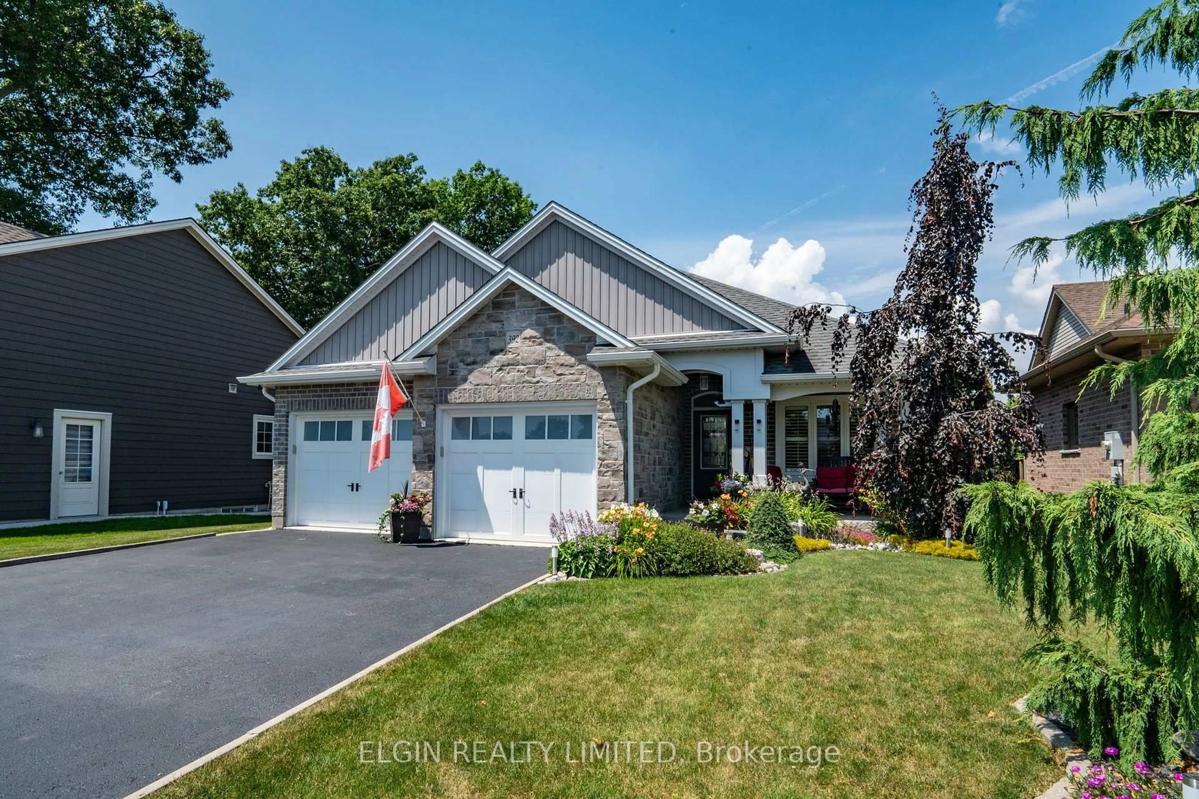 Home with vinyl exterior material, street for 392 Larry St, Central Elgin Ontario N5L 0A6