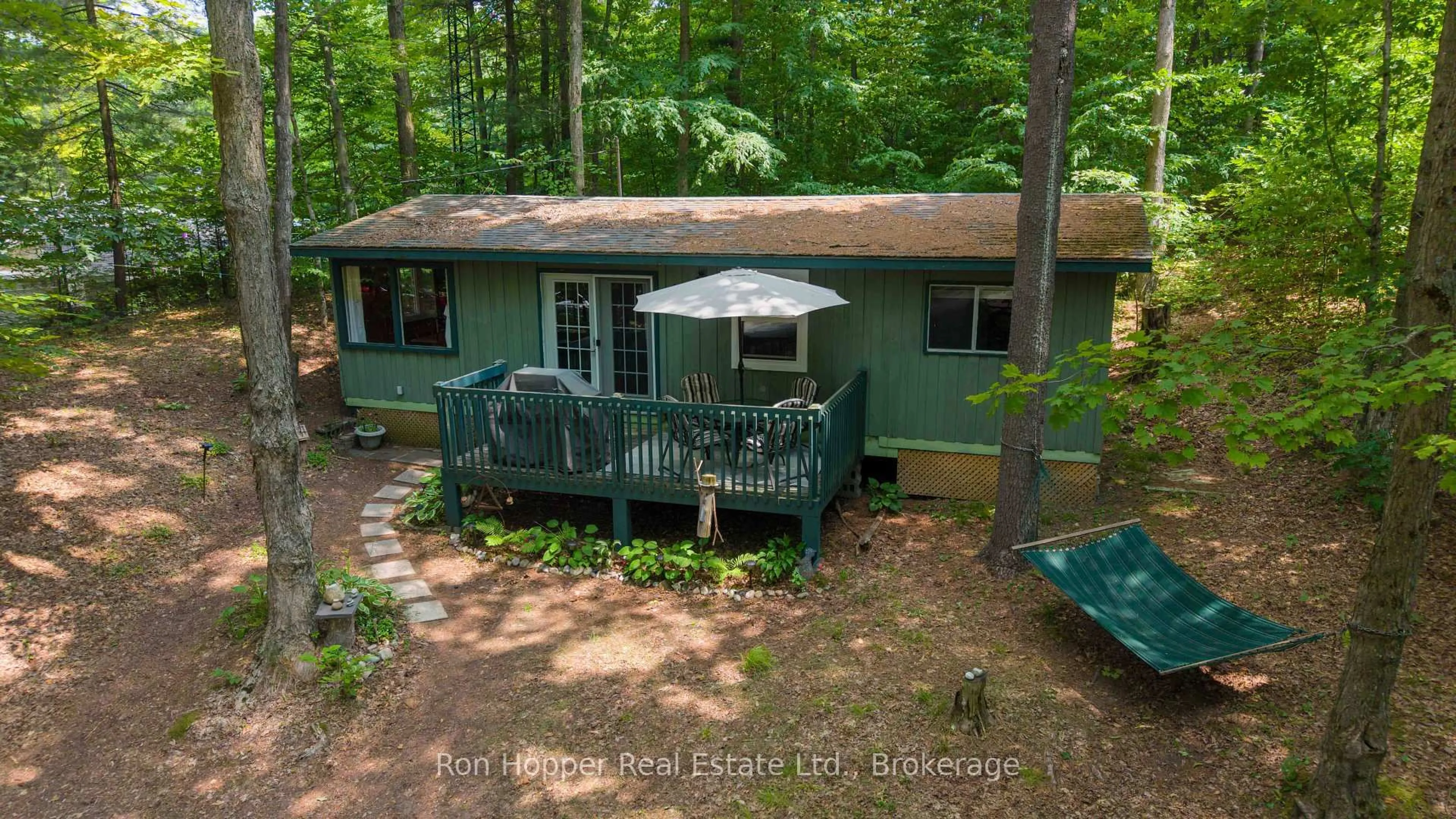 A pic from outside/outdoor area/front of a property/back of a property/a pic from drone, forest/trees view for 15 Burton Cres, South Bruce Peninsula Ontario N0H 2G0