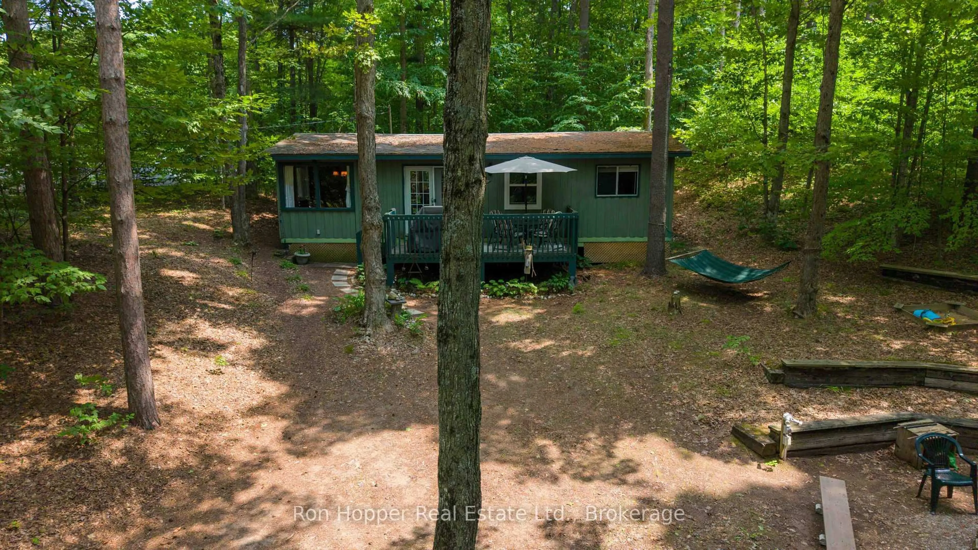A pic from outside/outdoor area/front of a property/back of a property/a pic from drone, forest/trees view for 15 Burton Cres, South Bruce Peninsula Ontario N0H 2G0