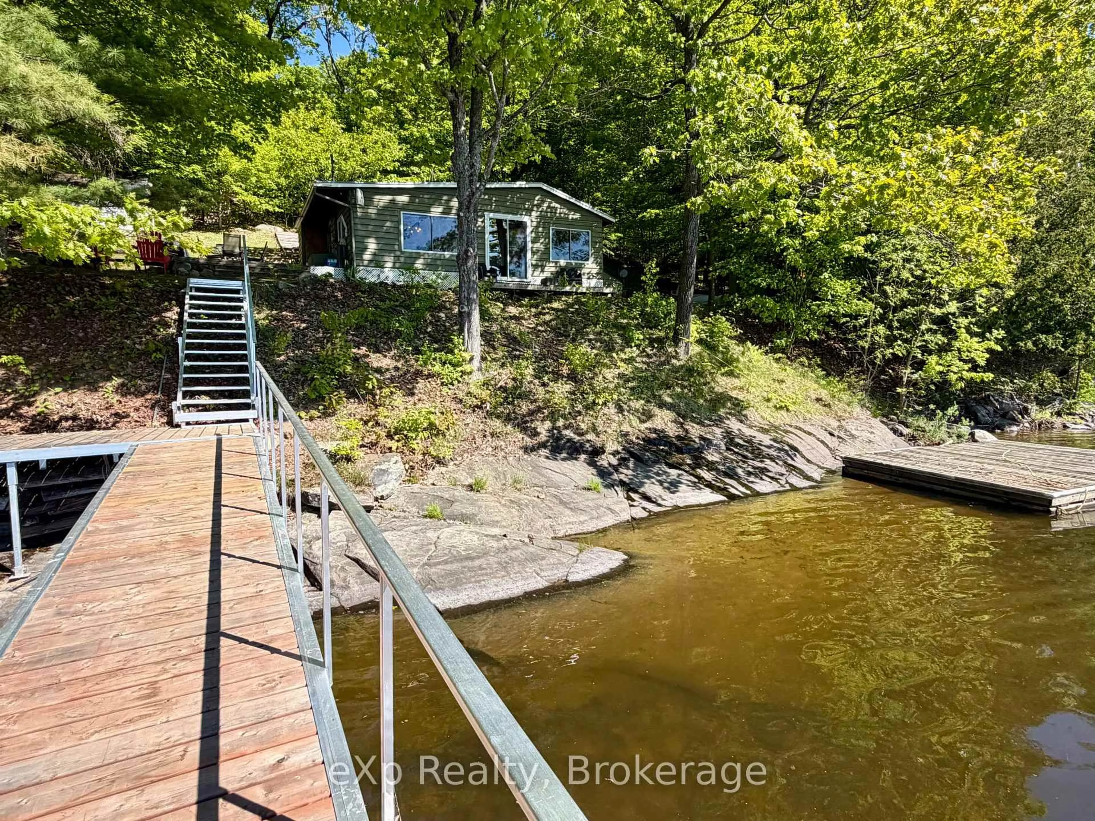 A pic from outside/outdoor area/front of a property/back of a property/a pic from drone, water/lake/river/ocean view for 1082 Cowan Park Rd #3, Muskoka Lakes Ontario P0B 1M0