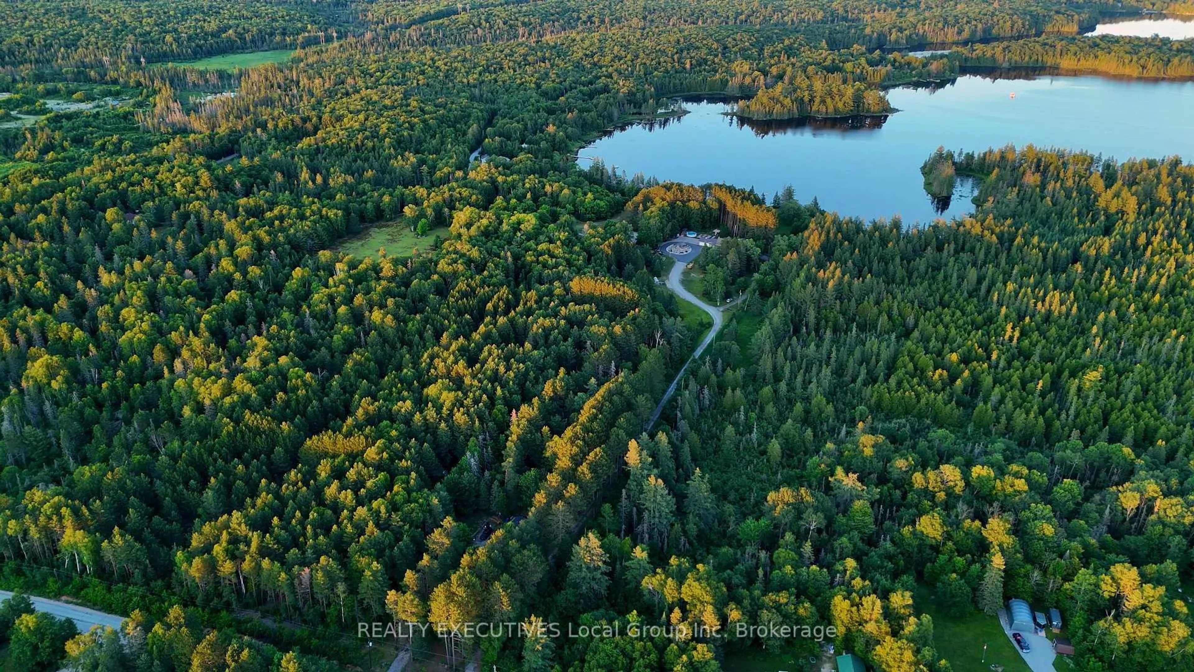 A pic from outside/outdoor area/front of a property/back of a property/a pic from drone, forest/trees view for 54 CHADBOURNE Dr, North Bay Ontario P1B 8G2