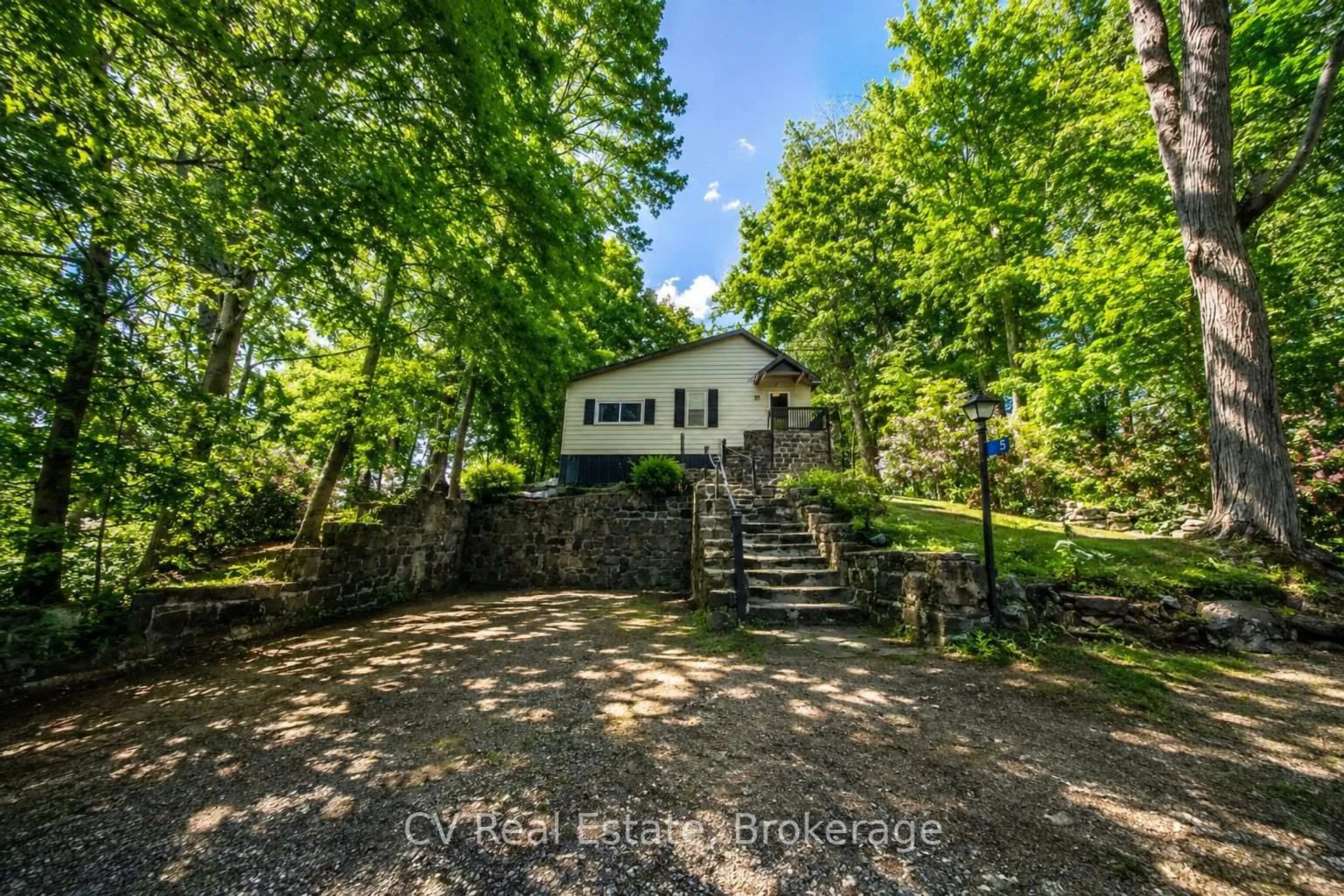 A pic from outside/outdoor area/front of a property/back of a property/a pic from drone, street for 1117 Bert Sims Rd #5, Muskoka Lakes Ontario P0B 1M0