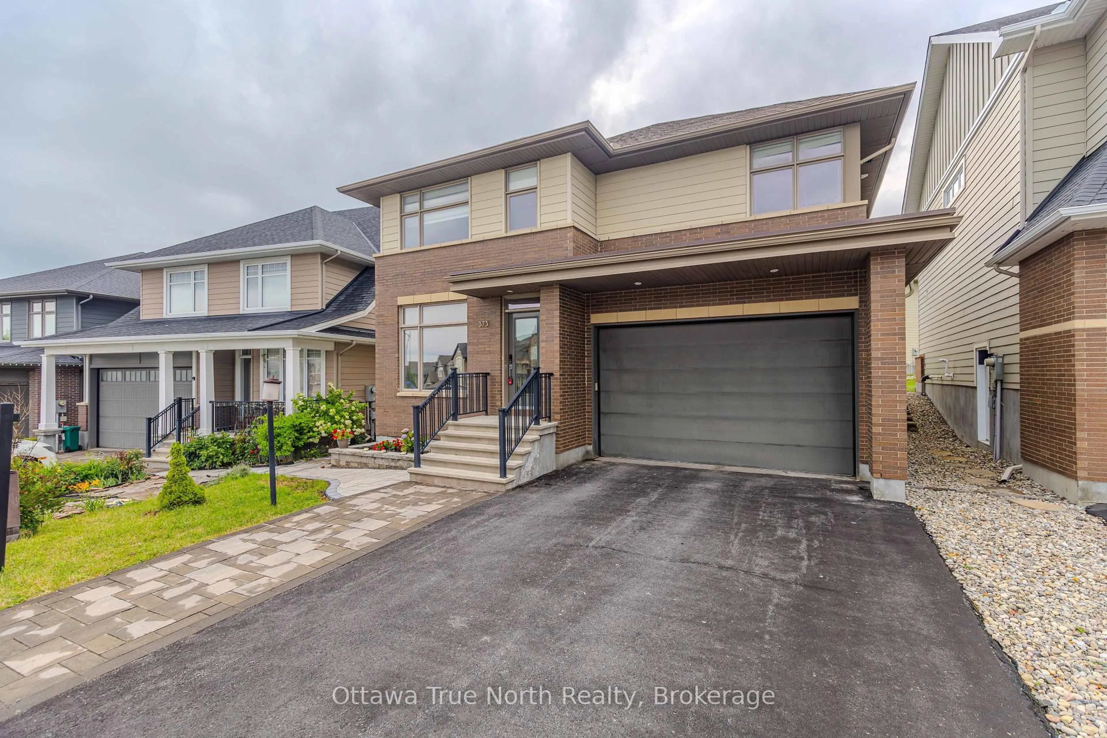 Home with brick exterior material, street for 373 Huntsville Dr, Ottawa Ontario K2T 0H5
