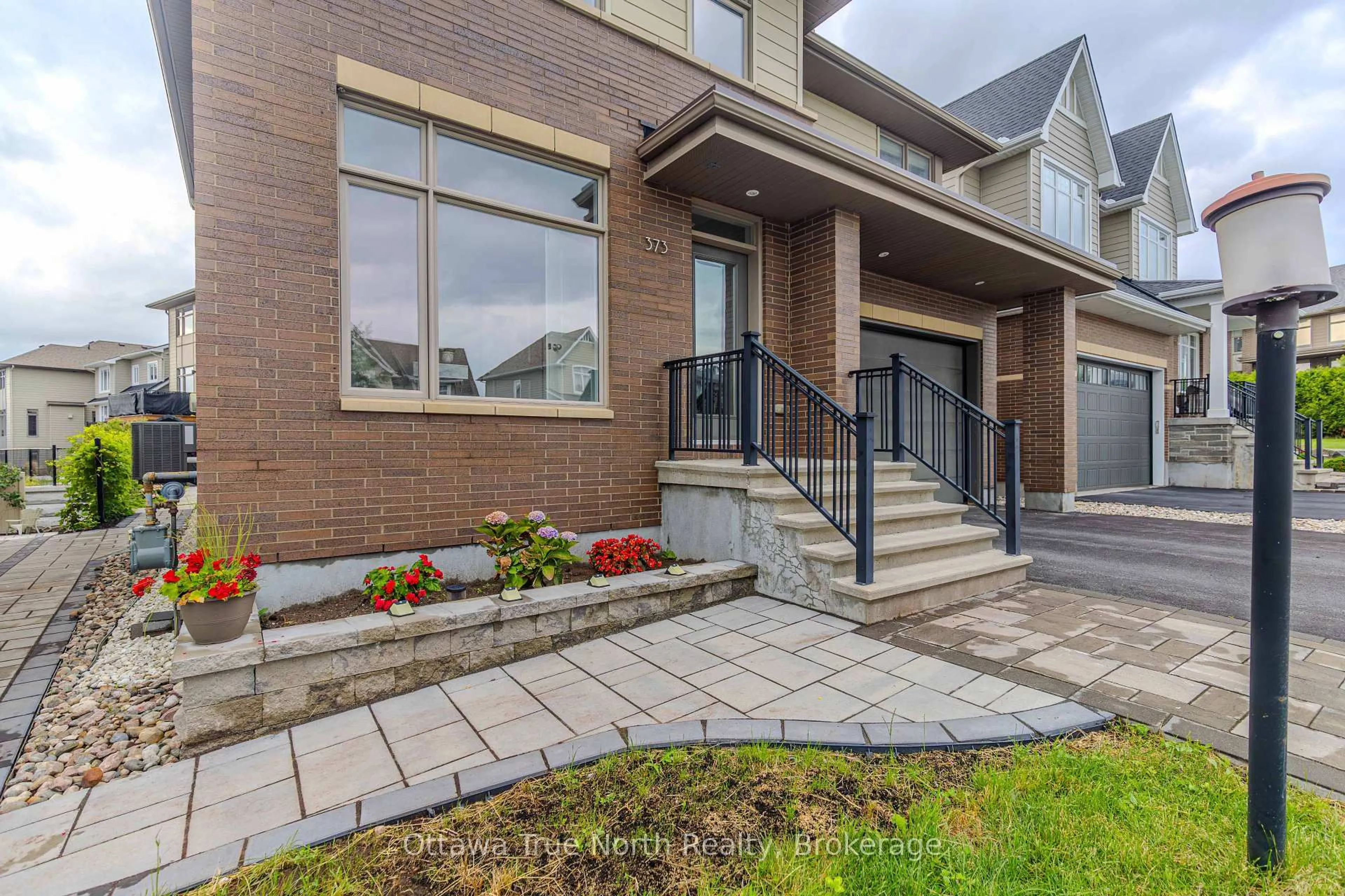 Home with brick exterior material, street for 373 Huntsville Dr, Ottawa Ontario K2T 0H5