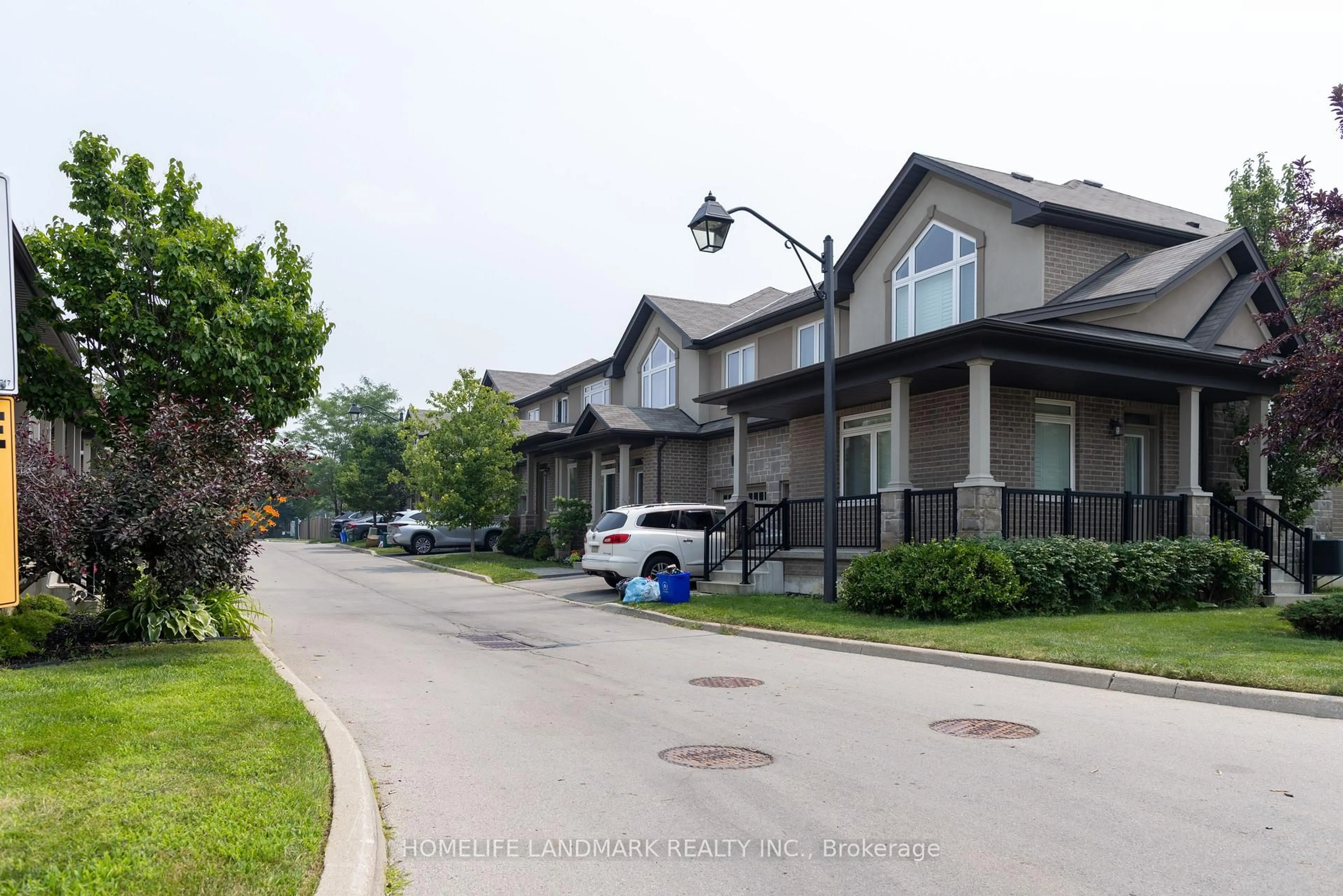 A pic from outside/outdoor area/front of a property/back of a property/a pic from drone, street for 421 Kitty Murray Lane #19, Hamilton Ontario L9G 3K9