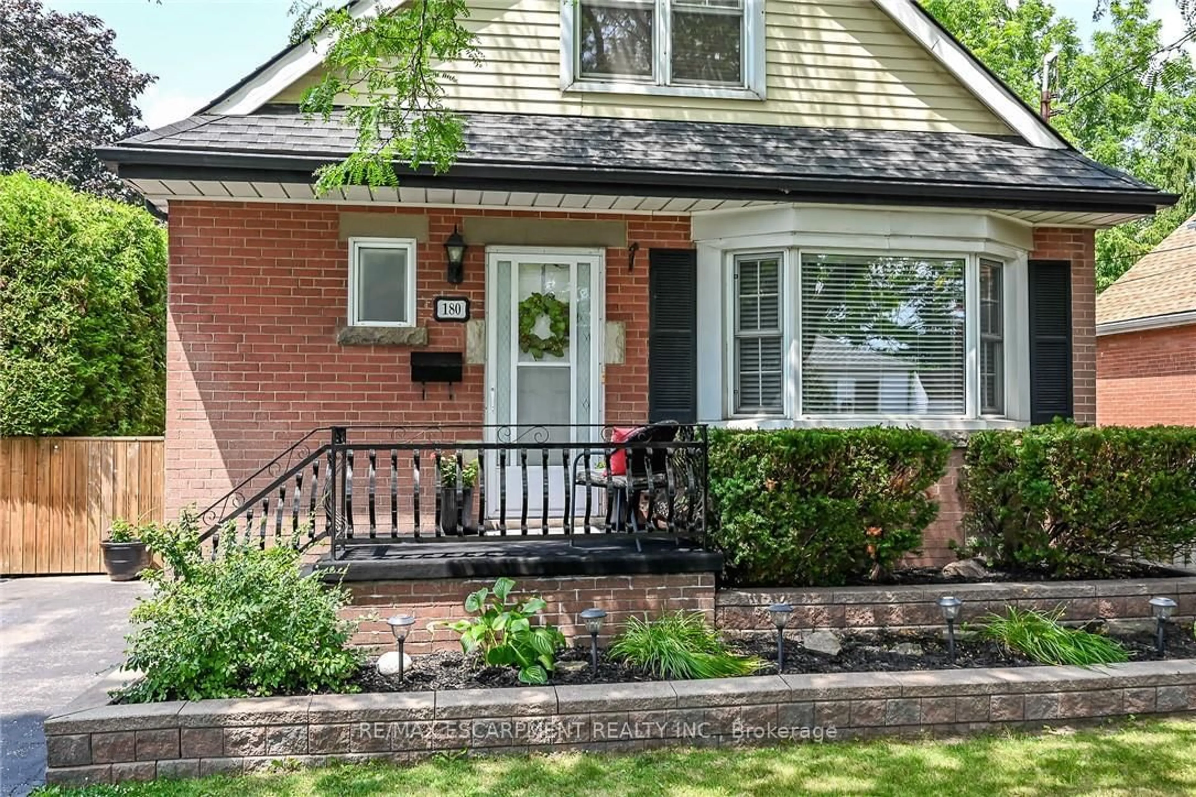 Home with brick exterior material, street for 180 East 25th St, Hamilton Ontario L8V 3A5