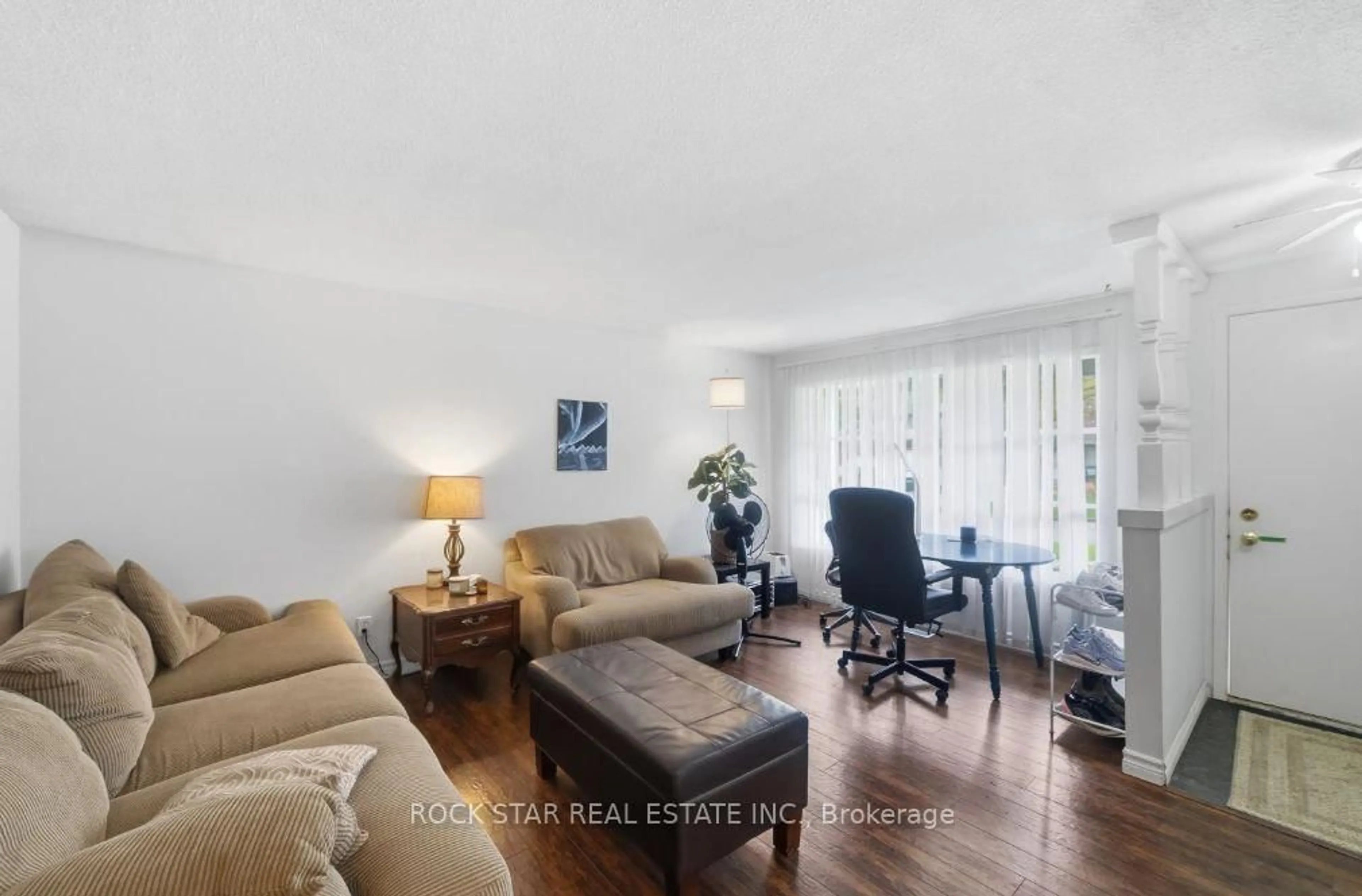 Living room with furniture, wood/laminate floor for 402 Midwood Cres, Waterloo Ontario N2L 5N5