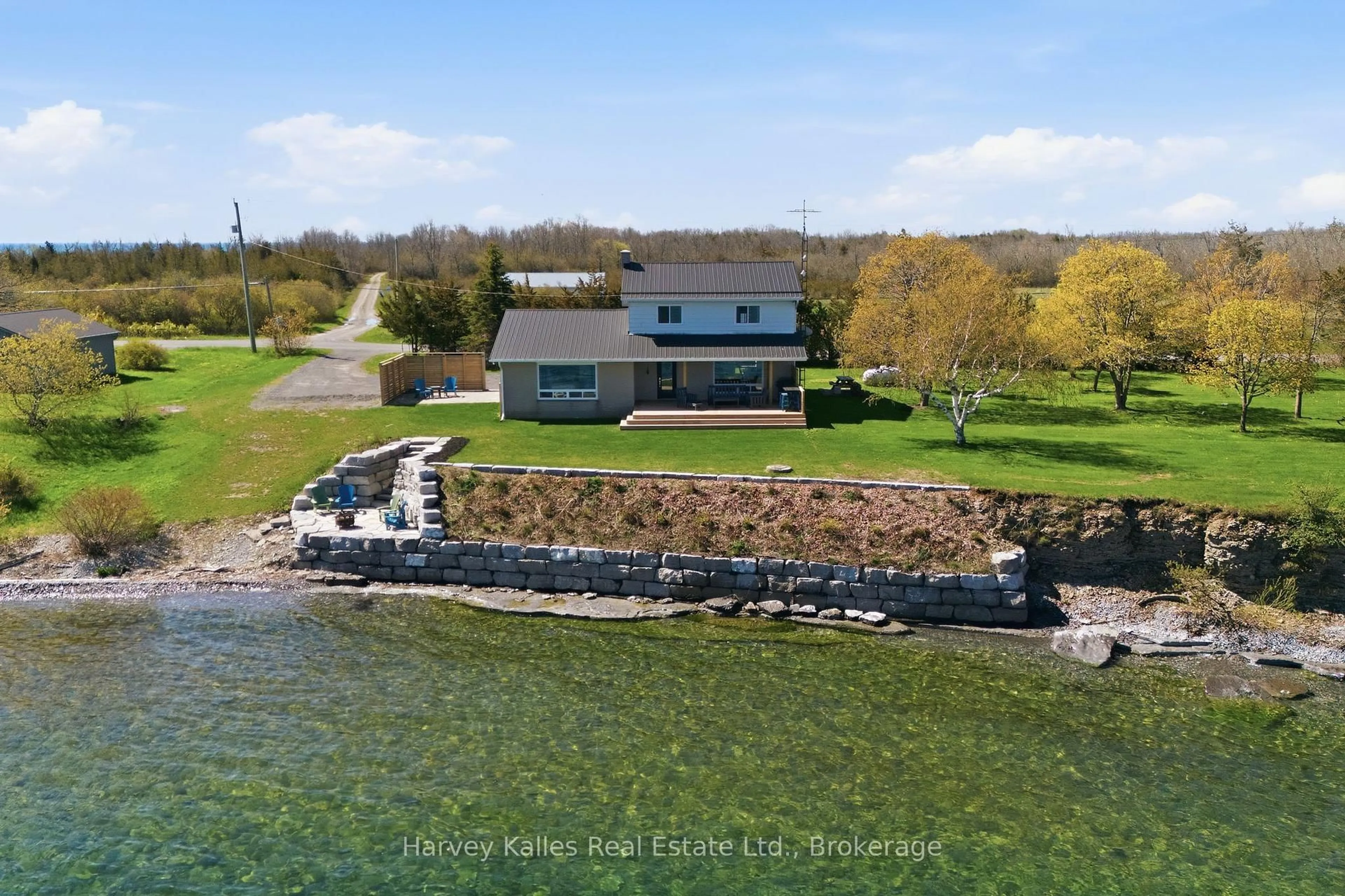 A pic from outside/outdoor area/front of a property/back of a property/a pic from drone, water/lake/river/ocean view for 4631 County Rd 13 Rd, Prince Edward County Ontario K0K 2P0