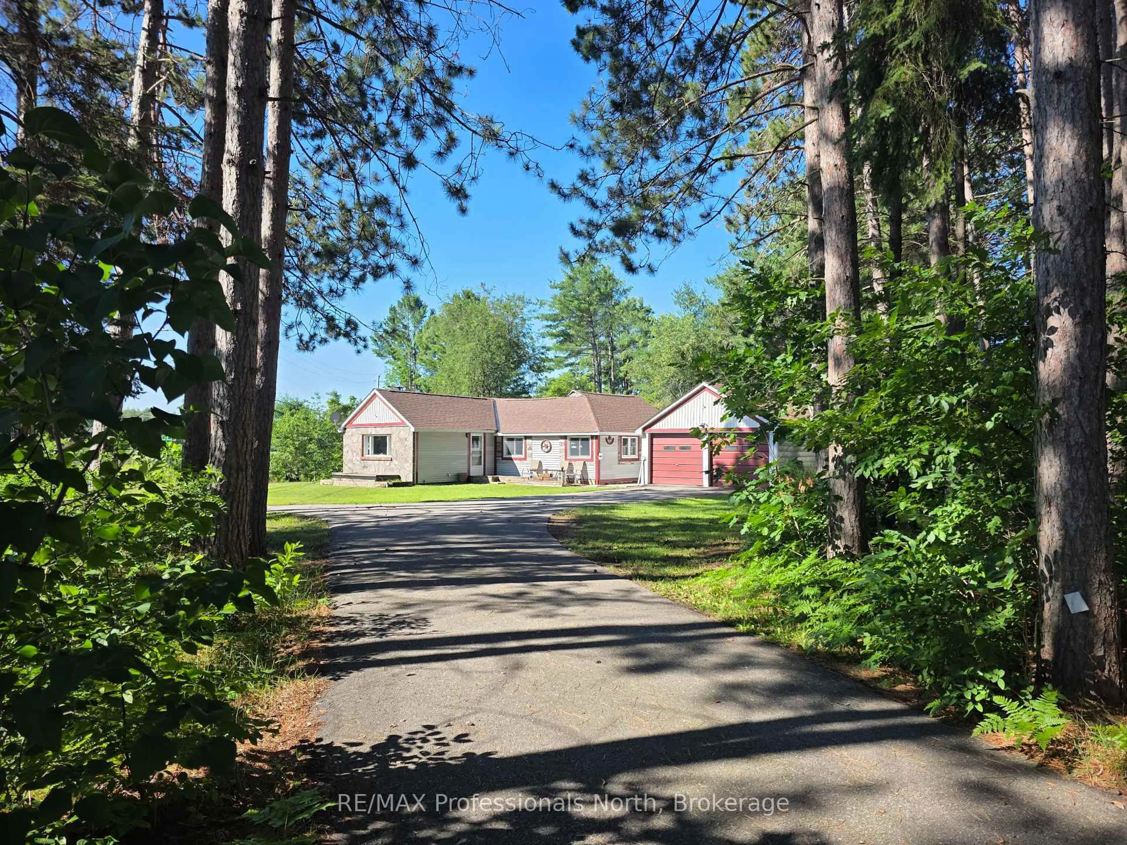 A pic from outside/outdoor area/front of a property/back of a property/a pic from drone, unknown for 1007 West Rd, Minden Hills Ontario K0M 2K0
