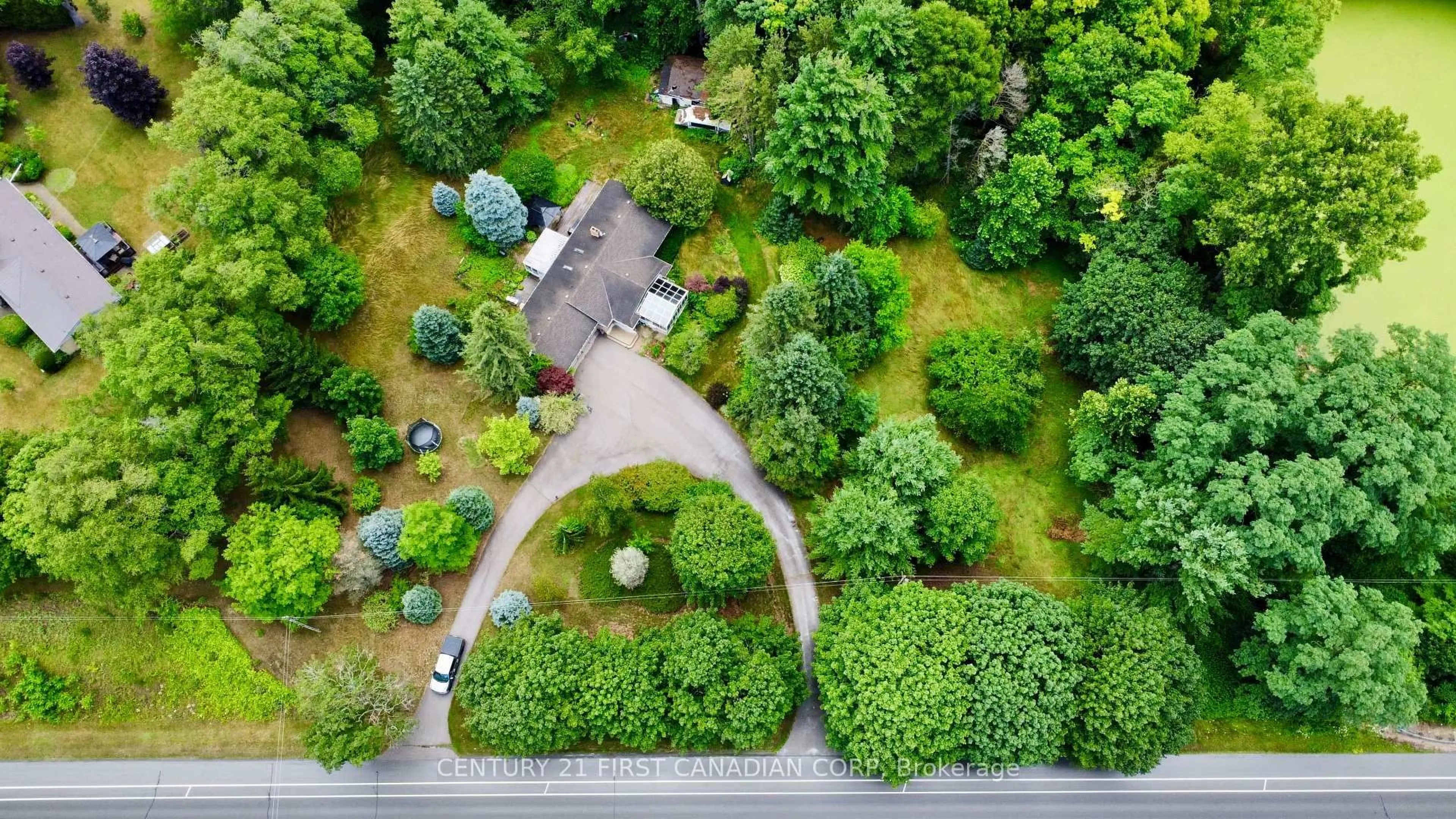 A pic from outside/outdoor area/front of a property/back of a property/a pic from drone, forest/trees view for 5820 SUNSET Rd, Central Elgin Ontario N0L 2L0