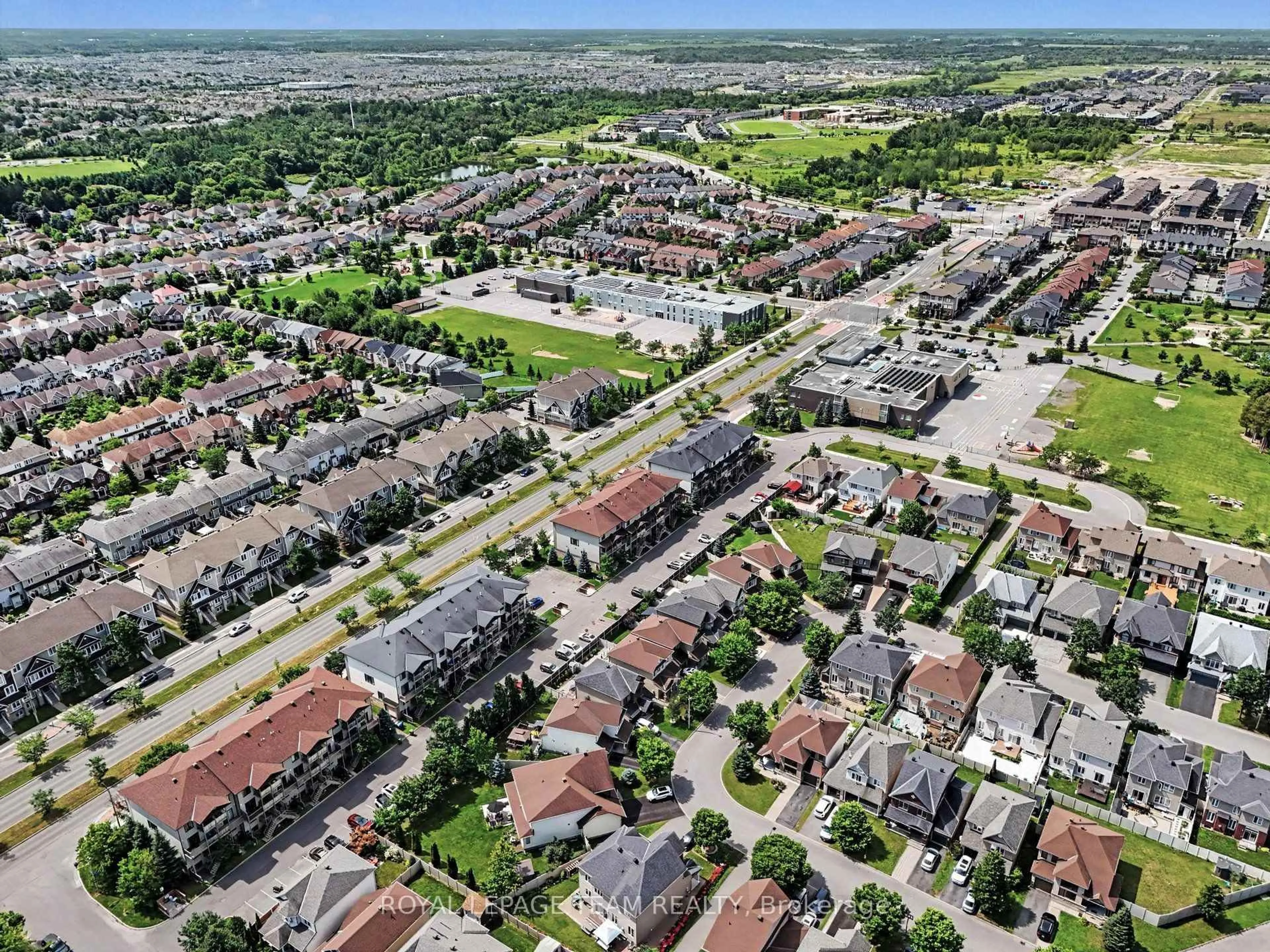 A pic from outside/outdoor area/front of a property/back of a property/a pic from drone, street for 621 Chapman Mills Dr #C, Ottawa Ontario K2J 5T1