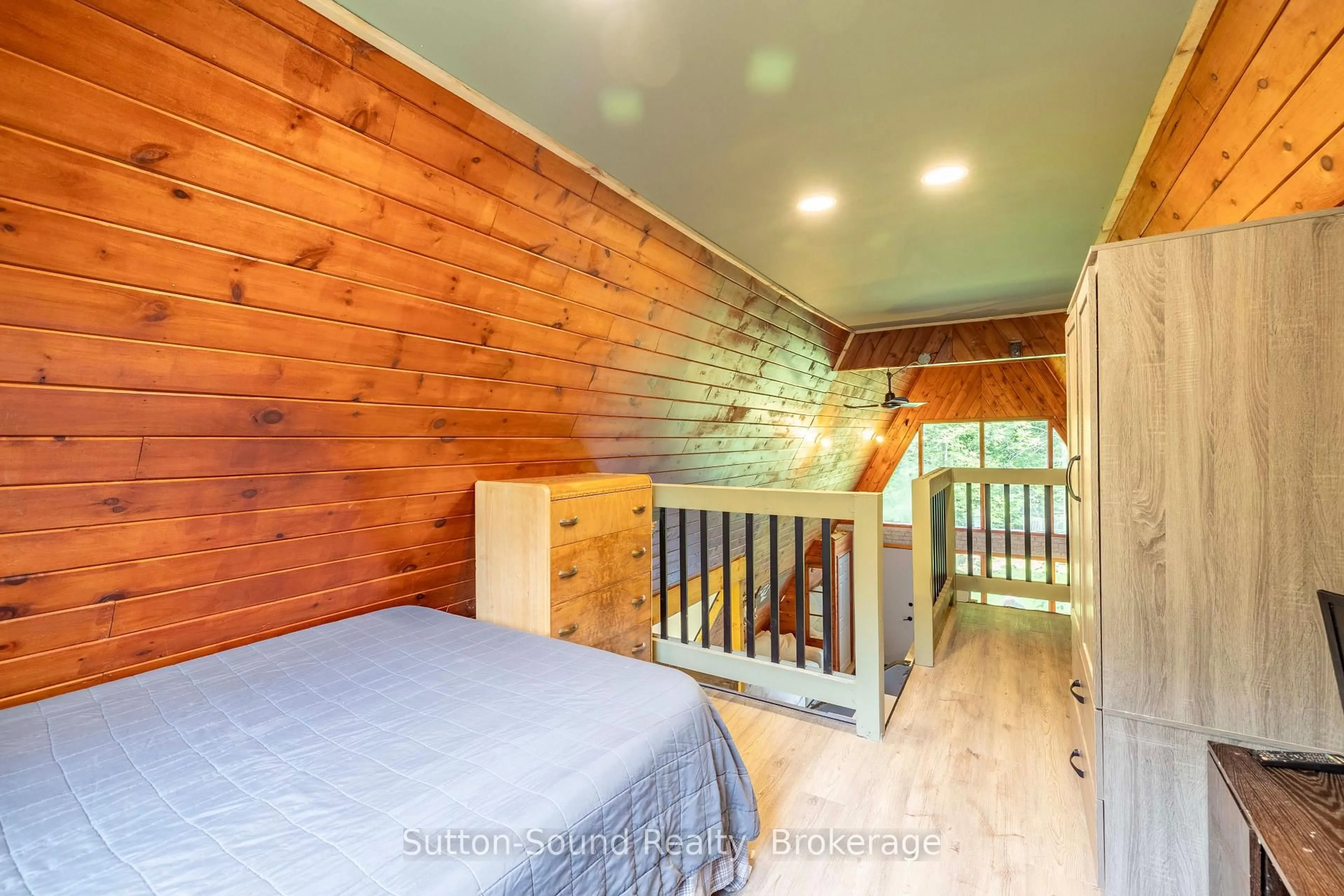 Bedroom with bed, wood/laminate floor for 113 Big Rock Rd, Georgian Bluffs Ontario N0H 2K0