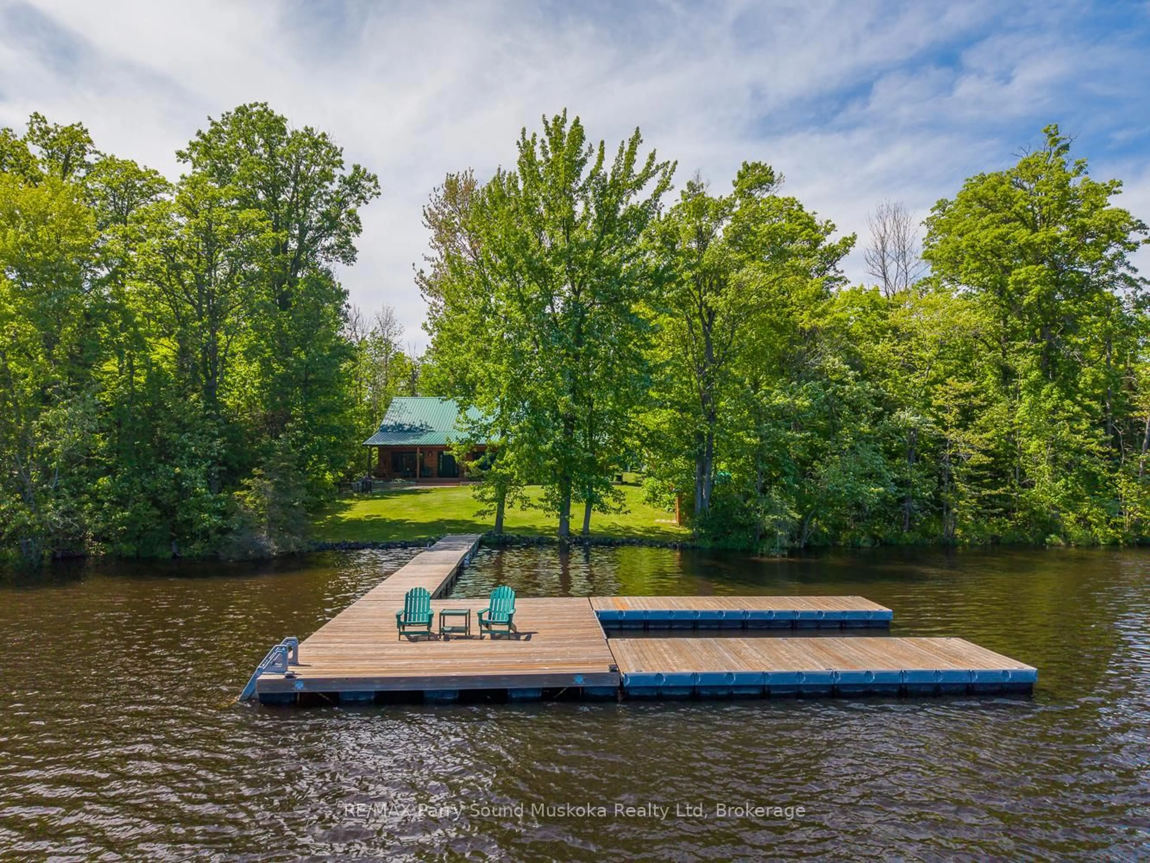 A pic from outside/outdoor area/front of a property/back of a property/a pic from drone, water/lake/river/ocean view for 48 Wendy's Lane, McKellar Ontario P2A 0B5