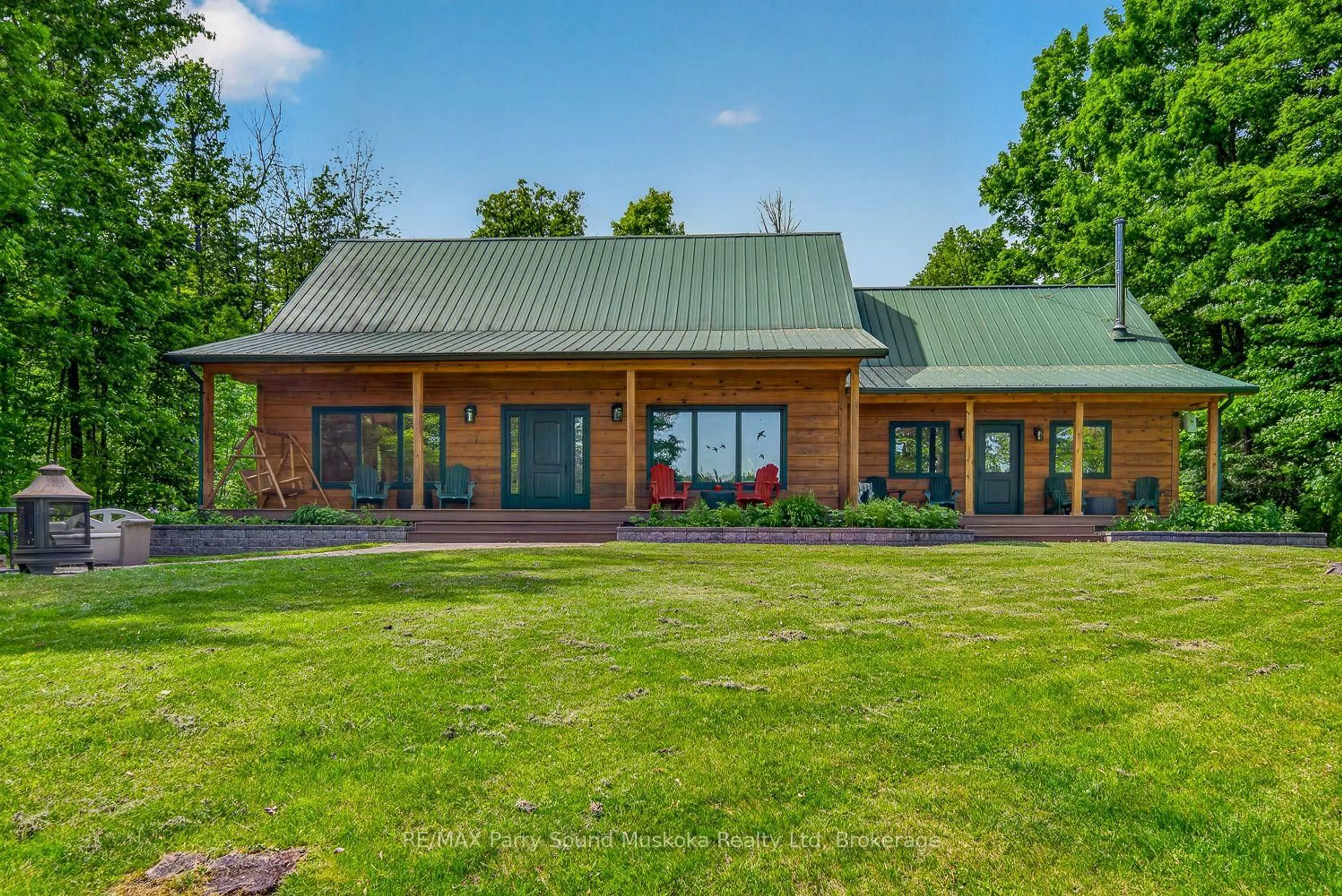A pic from outside/outdoor area/front of a property/back of a property/a pic from drone, water/lake/river/ocean view for 48 Wendy's Lane, McKellar Ontario P2A 0B5