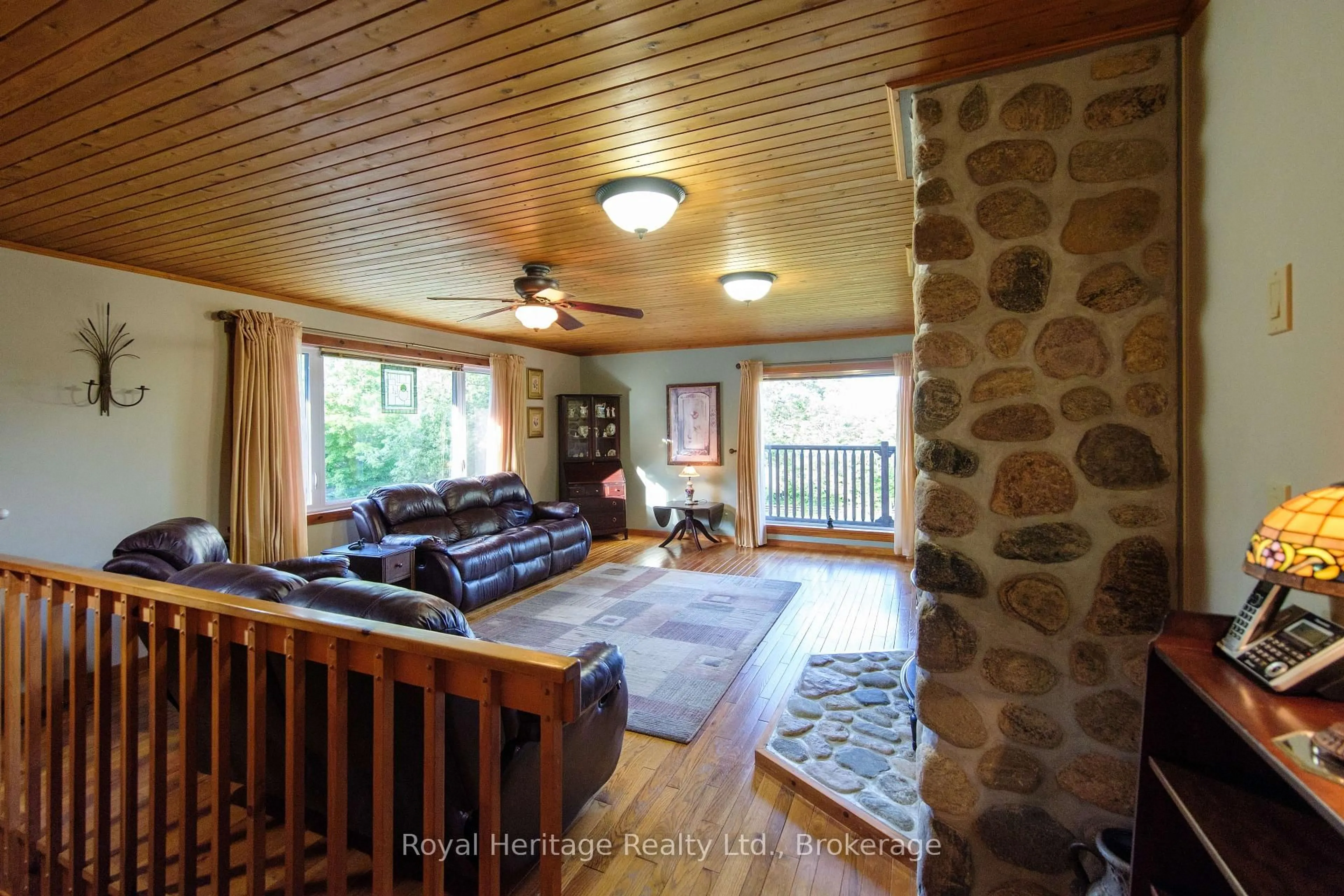 Living room with furniture, wood/laminate floor for 497 Mooney Rd, Bancroft Ontario K0L 1C0