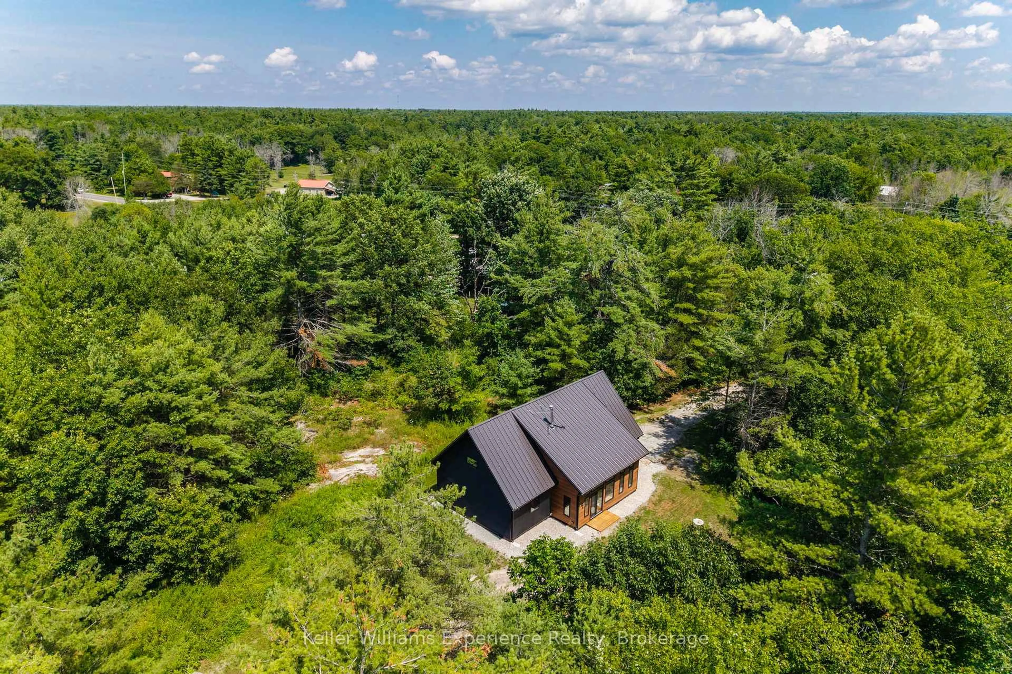 A pic from outside/outdoor area/front of a property/back of a property/a pic from drone, forest/trees view for 753 Honey Harbour Rd, Georgian Bay Ontario L0K 1S0