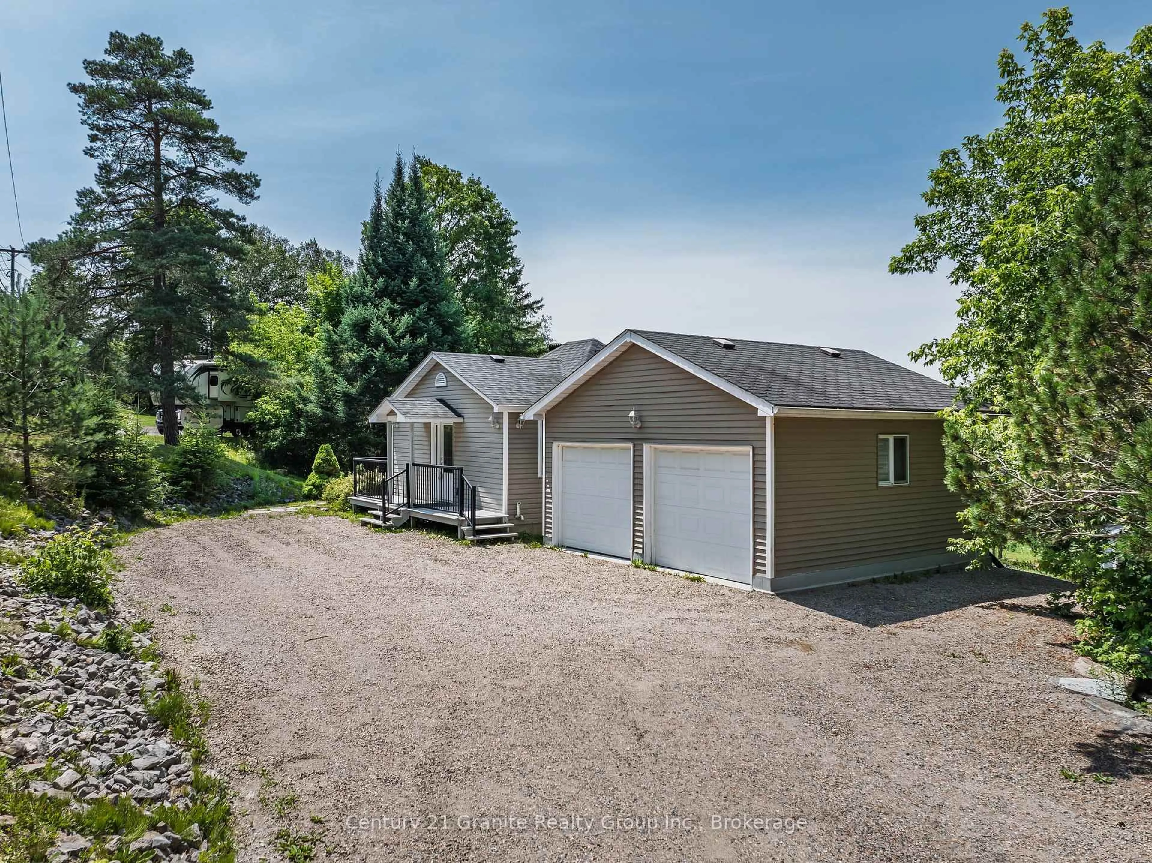 A pic from outside/outdoor area/front of a property/back of a property/a pic from drone, street for 7177 Gelert Rd, Dysart et al Ontario K0M 1S0