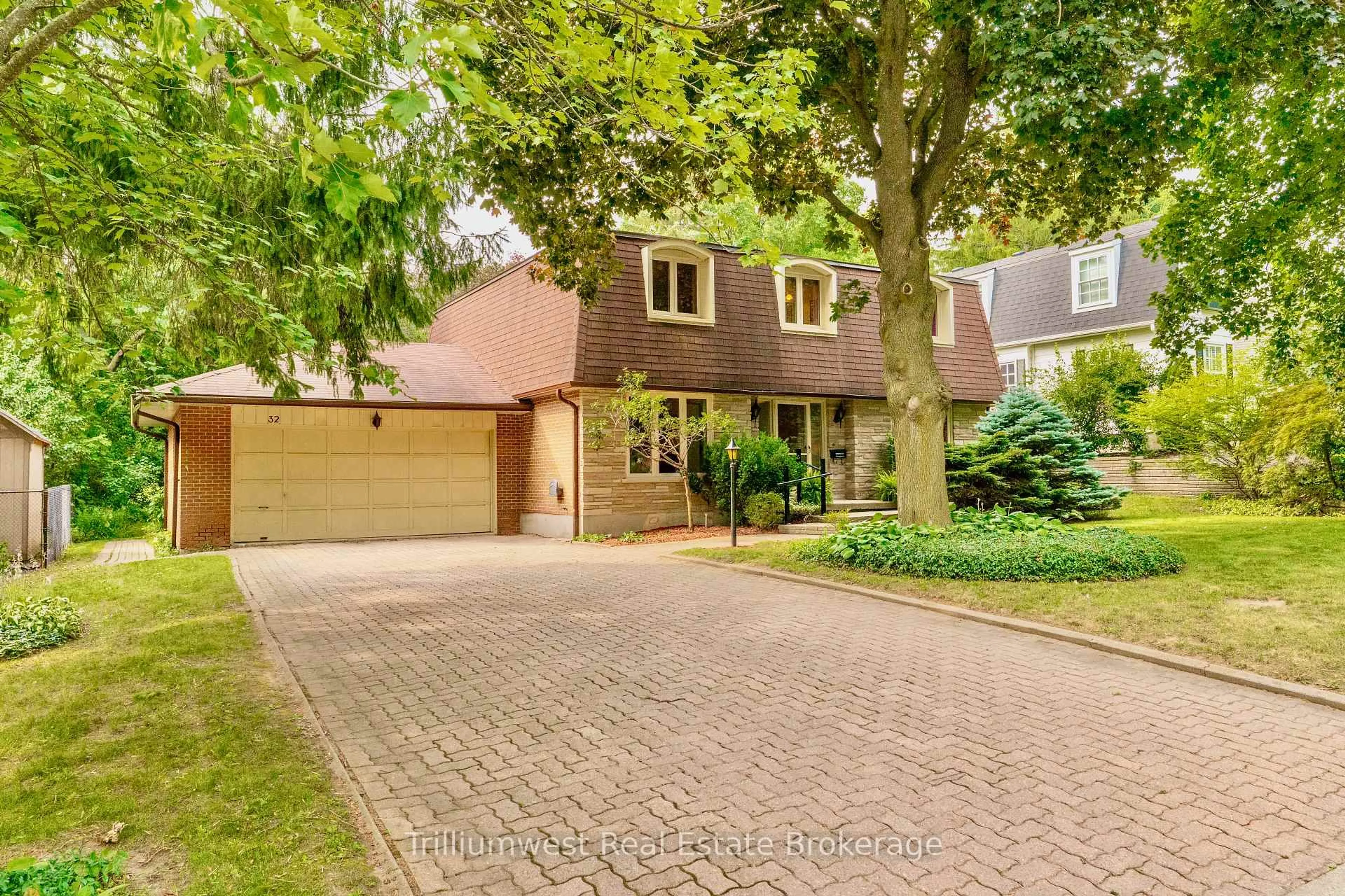 Home with brick exterior material, street for 32 Waverley Dr, Guelph Ontario N1E 6C8