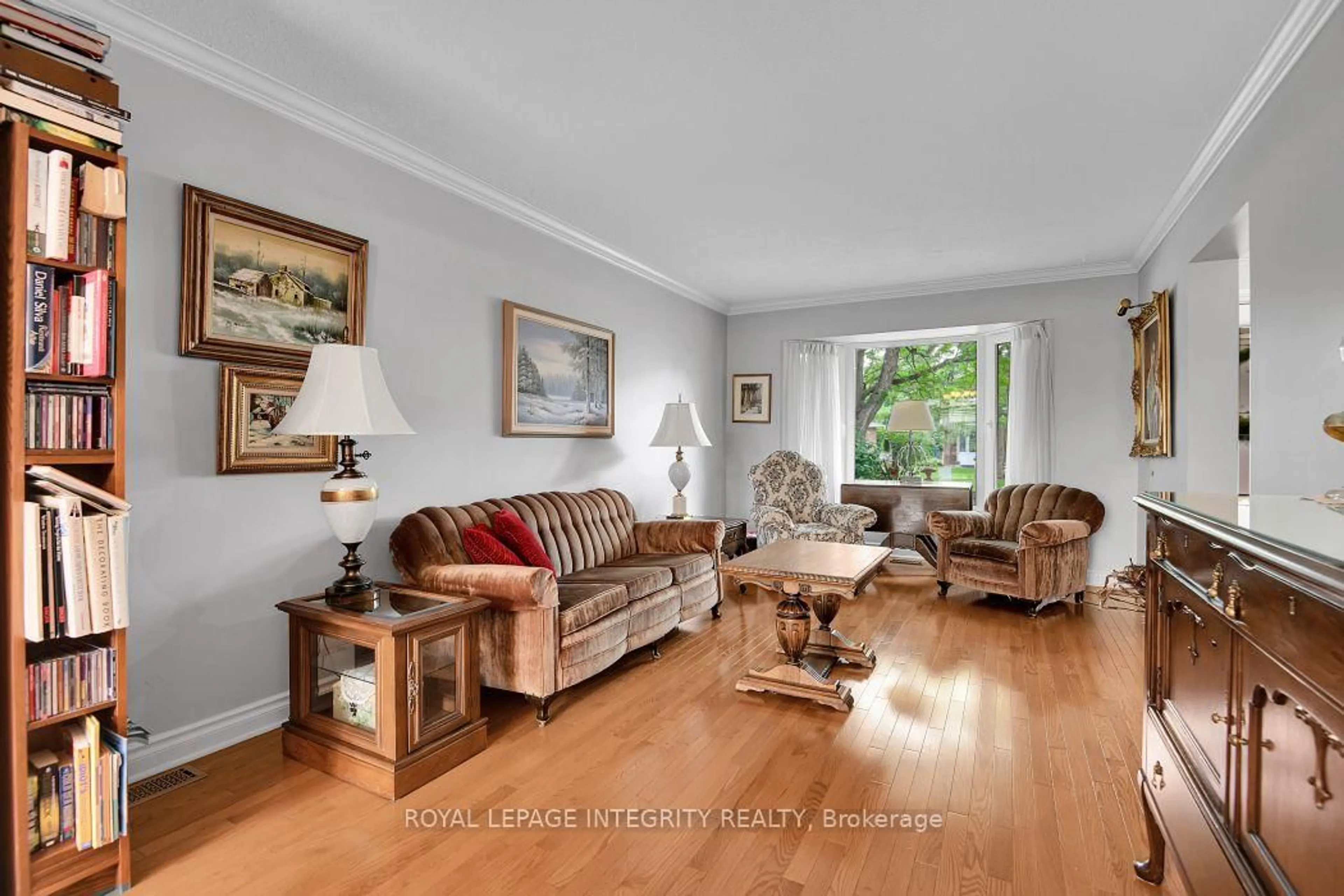 Living room with furniture, wood/laminate floor for 46 Dartmoor Dr, Kanata Ontario K2M 1S6