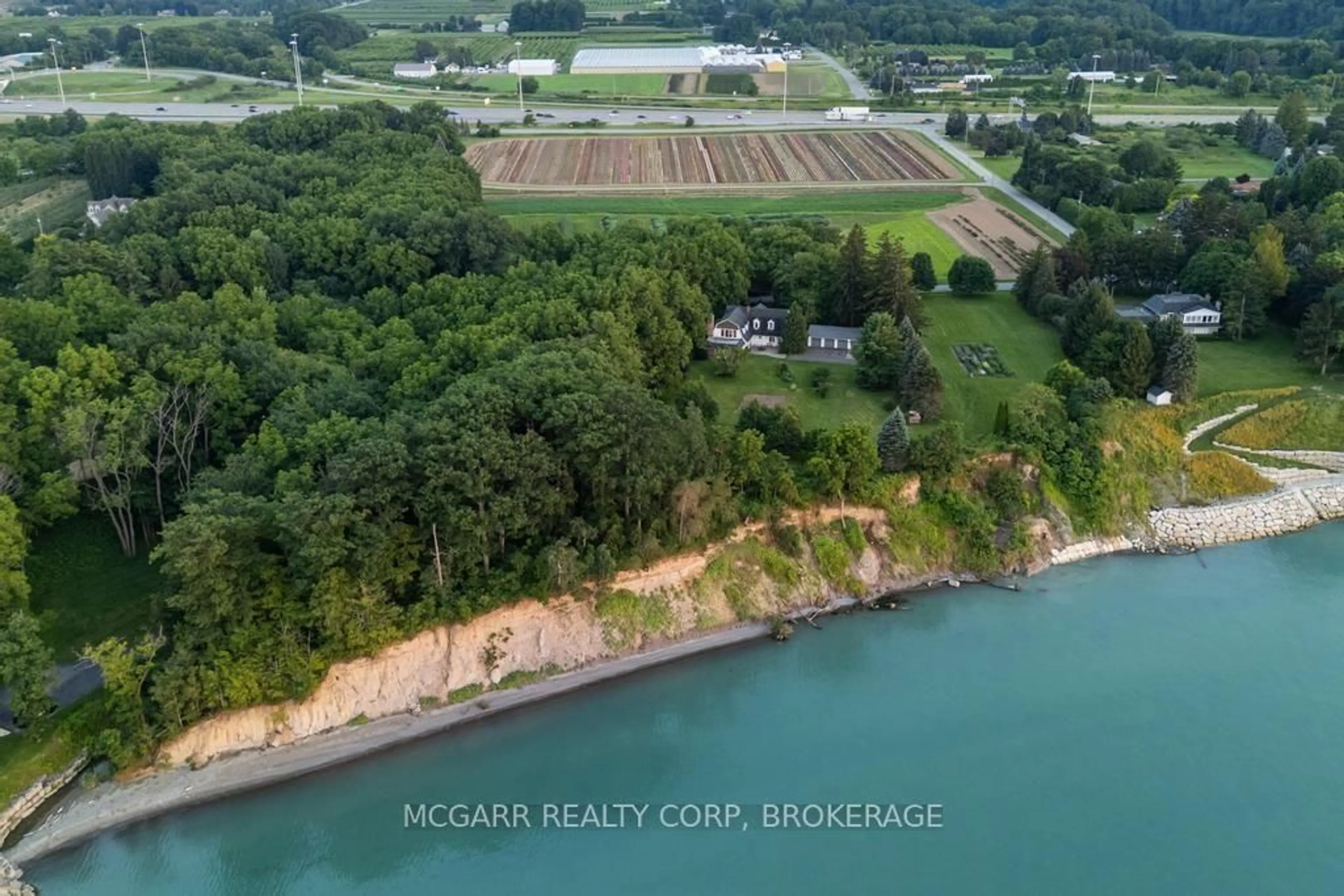 A pic from outside/outdoor area/front of a property/back of a property/a pic from drone, water/lake/river/ocean view for 1258 Lakeshore Rd, St. Catharines Ontario L2R 6P9