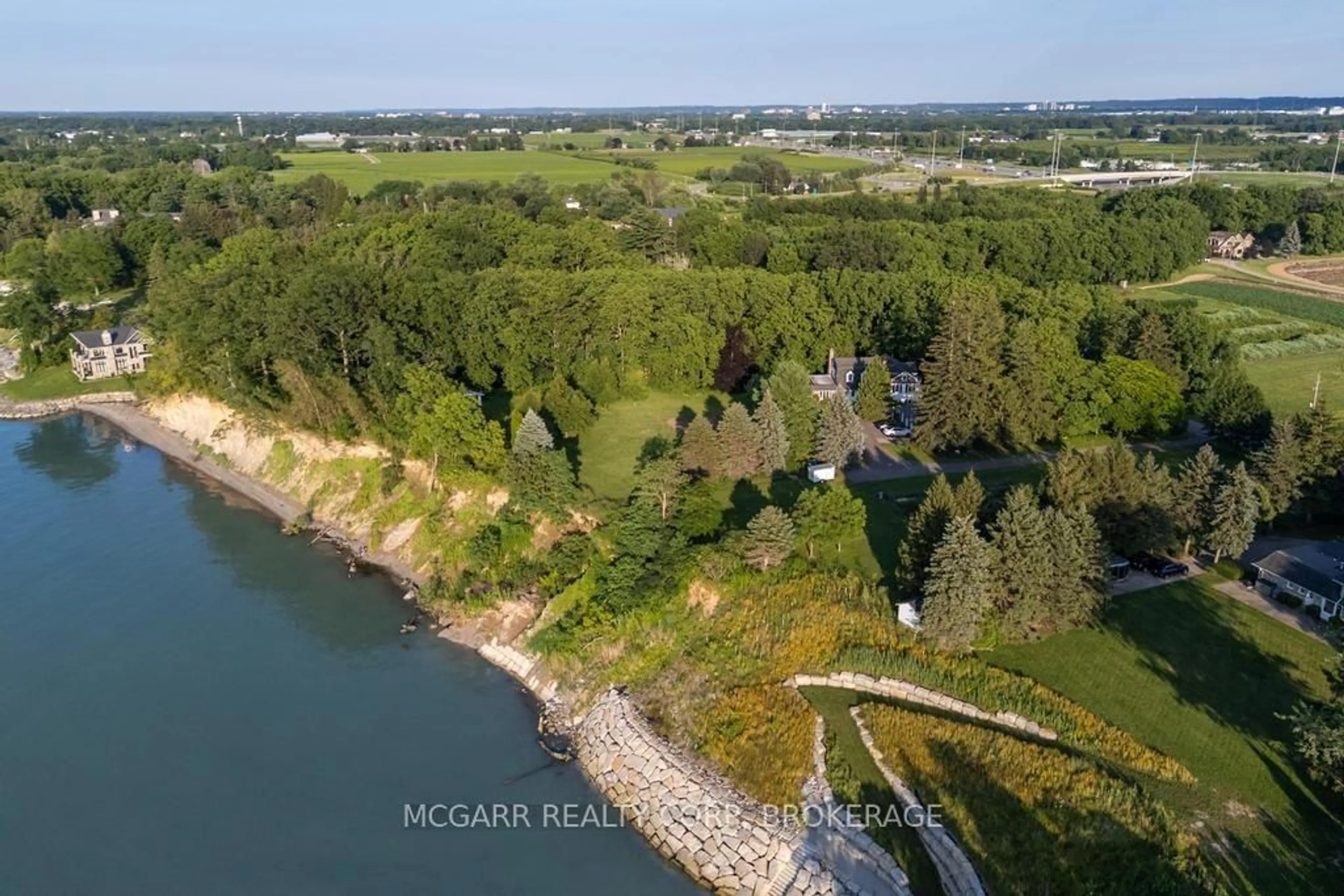 A pic from outside/outdoor area/front of a property/back of a property/a pic from drone, water/lake/river/ocean view for 1258 Lakeshore Rd, St. Catharines Ontario L2R 6P9