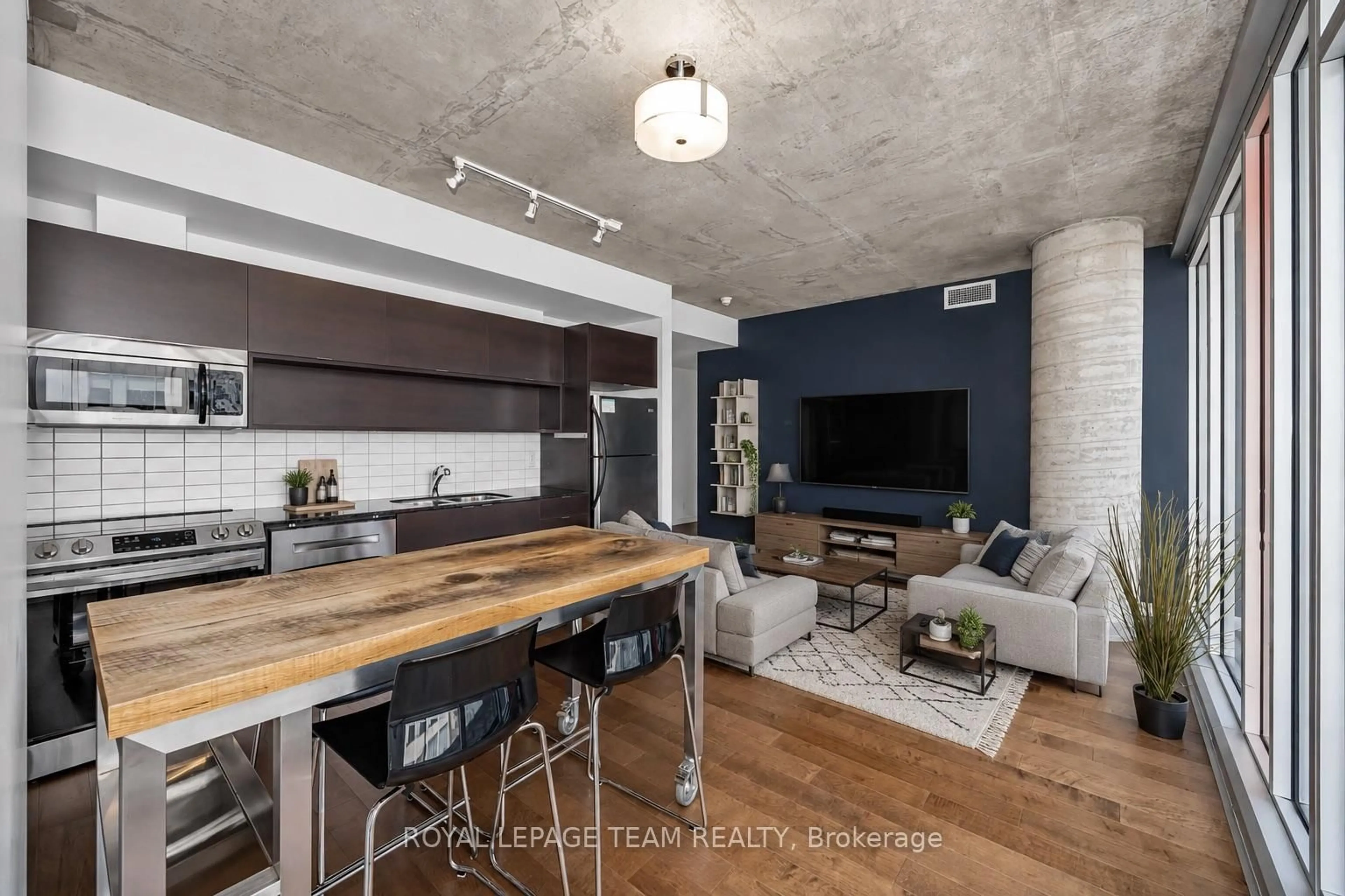 Open concept kitchen, cement floor for 324 Laurier Ave #2010, Ottawa Ontario K1N 6P6