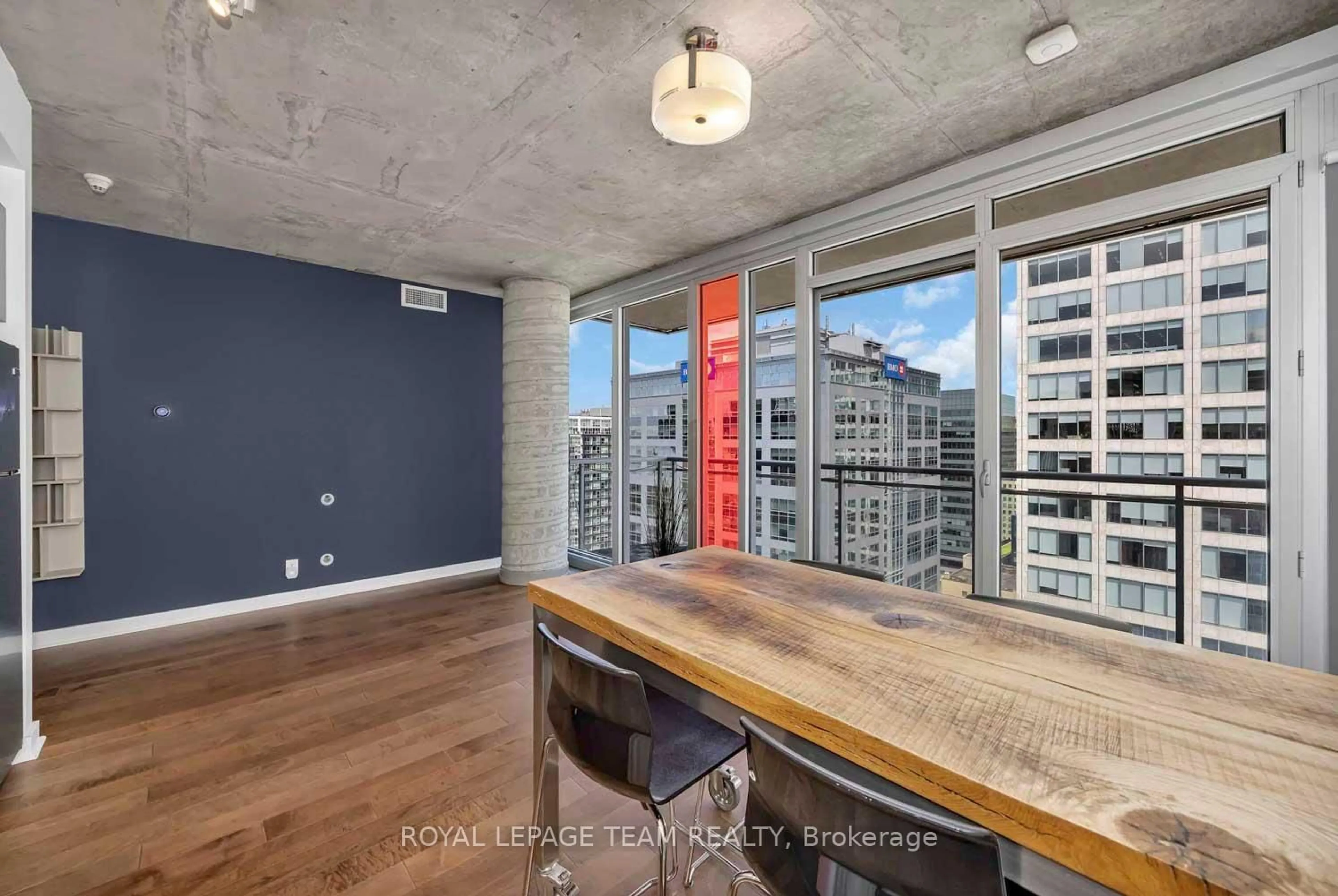 Open concept kitchen, cement floor for 324 Laurier Ave #2010, Ottawa Ontario K1N 6P6