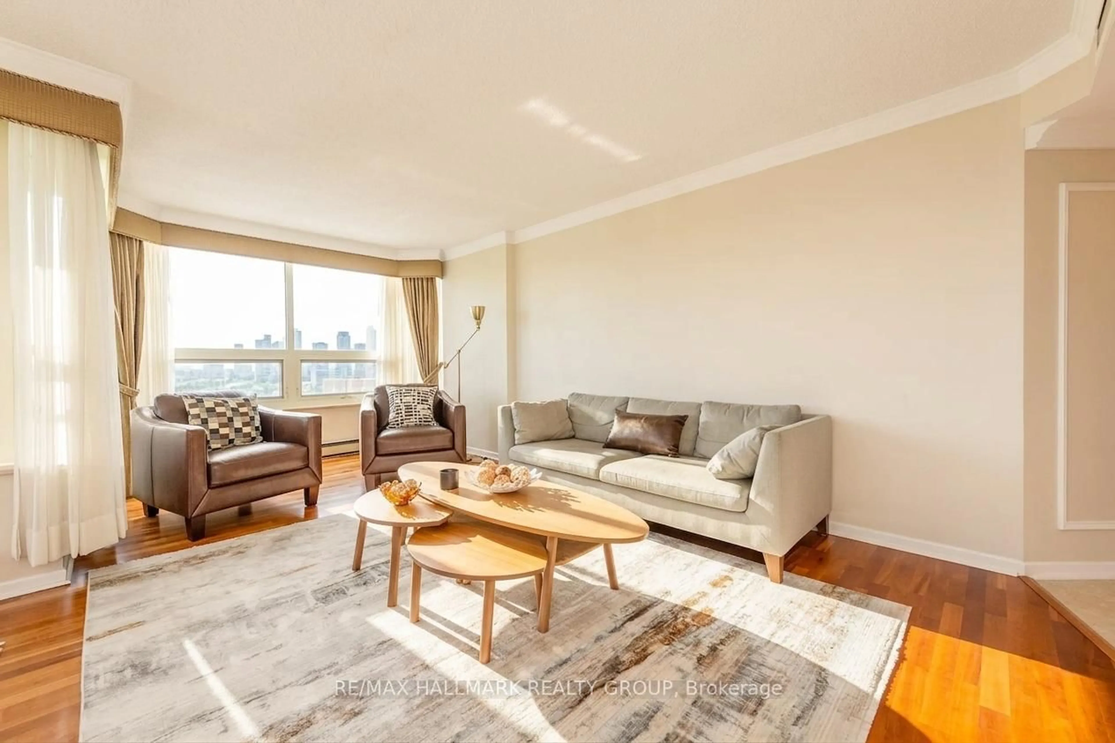 Living room with furniture, wood/laminate floor for 1510 Riverside Dr #1702, Ottawa Ontario K1G 4X5