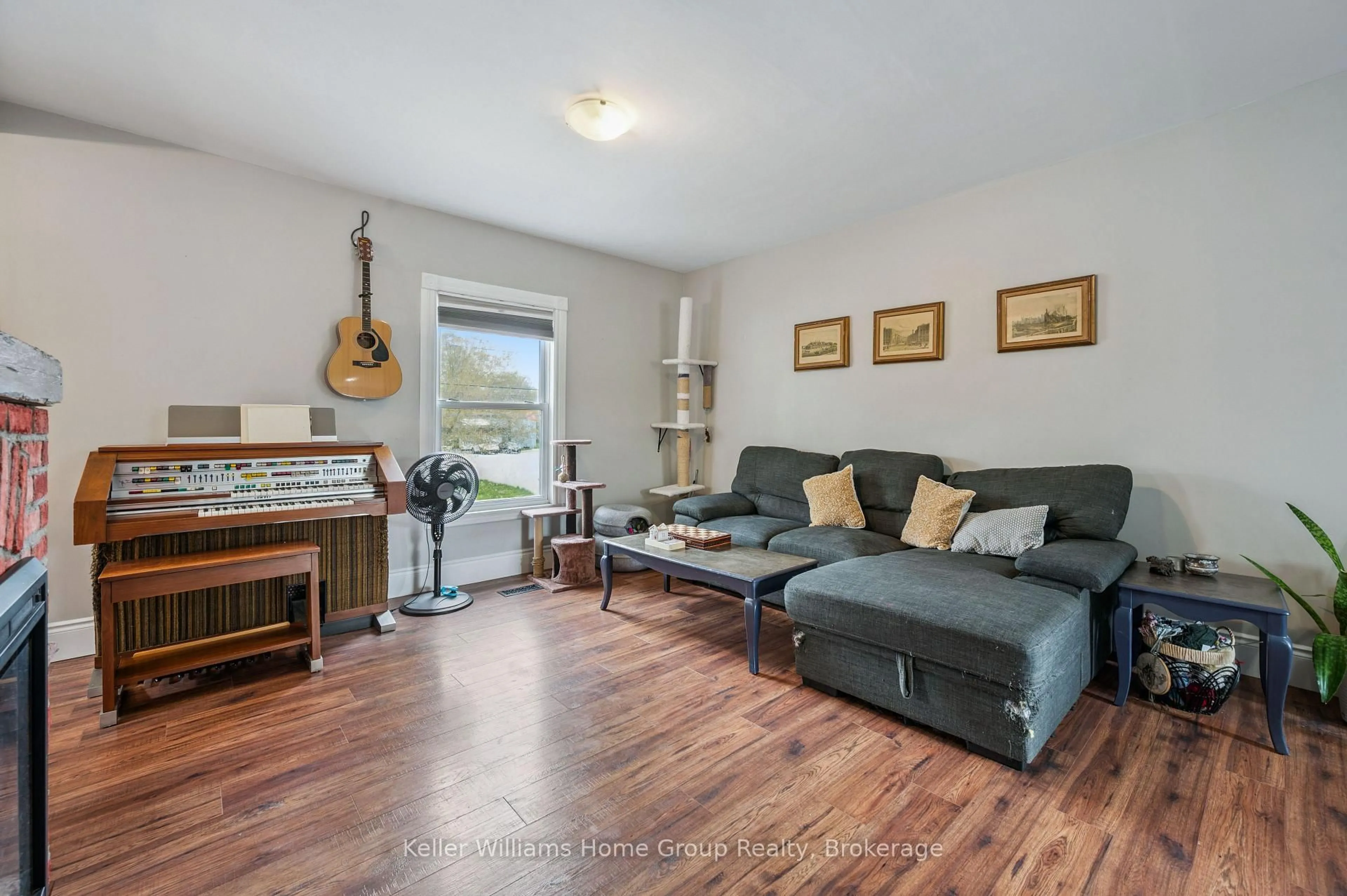 Living room with furniture, wood/laminate floor for 67 STEVENSON St, Guelph Ontario N1E 5N3