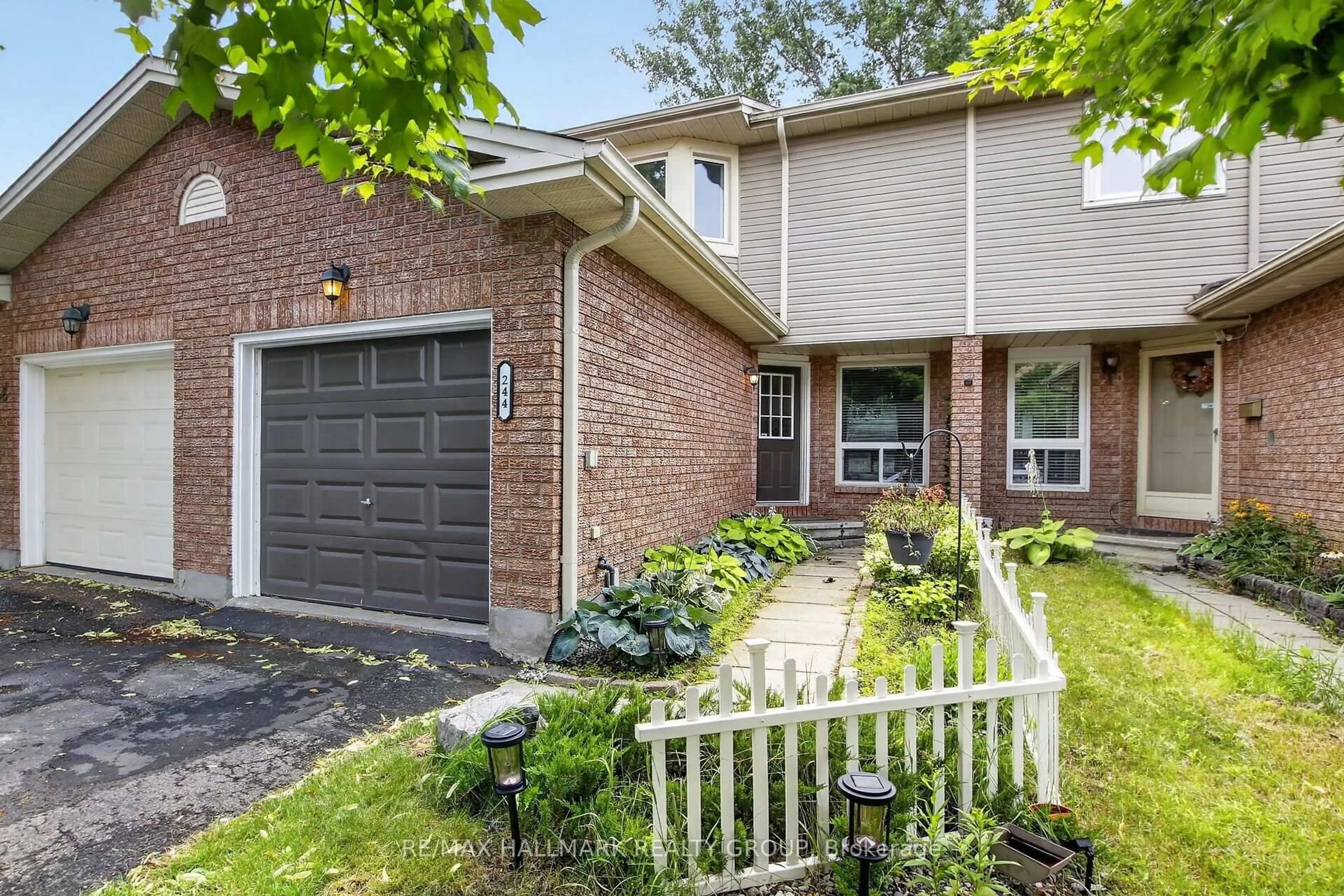 Home with brick exterior material, street for 244 Huntersfield Dr, Ottawa Ontario K1T 3M5