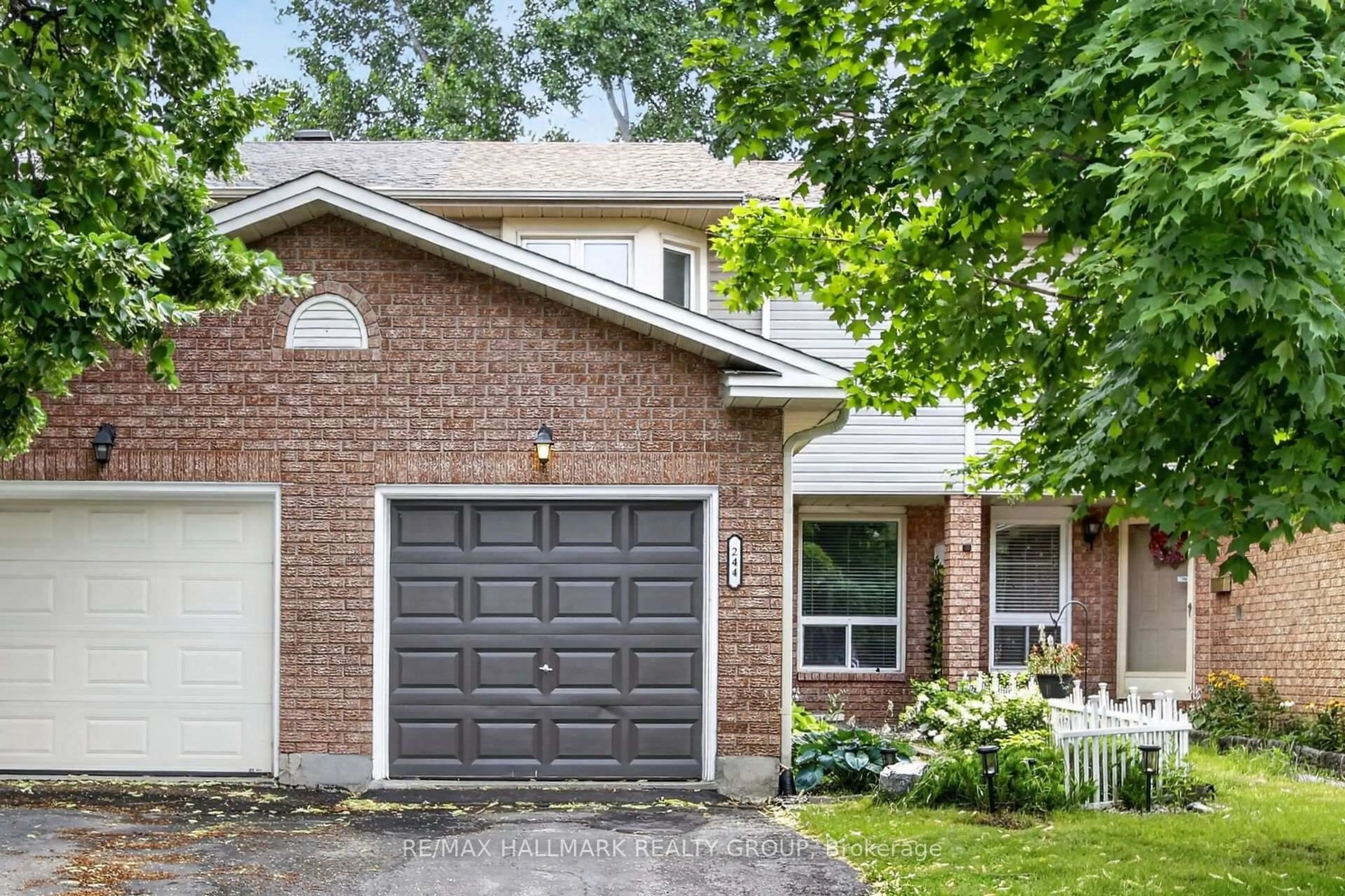 Home with brick exterior material, street for 244 Huntersfield Dr, Ottawa Ontario K1T 3M5