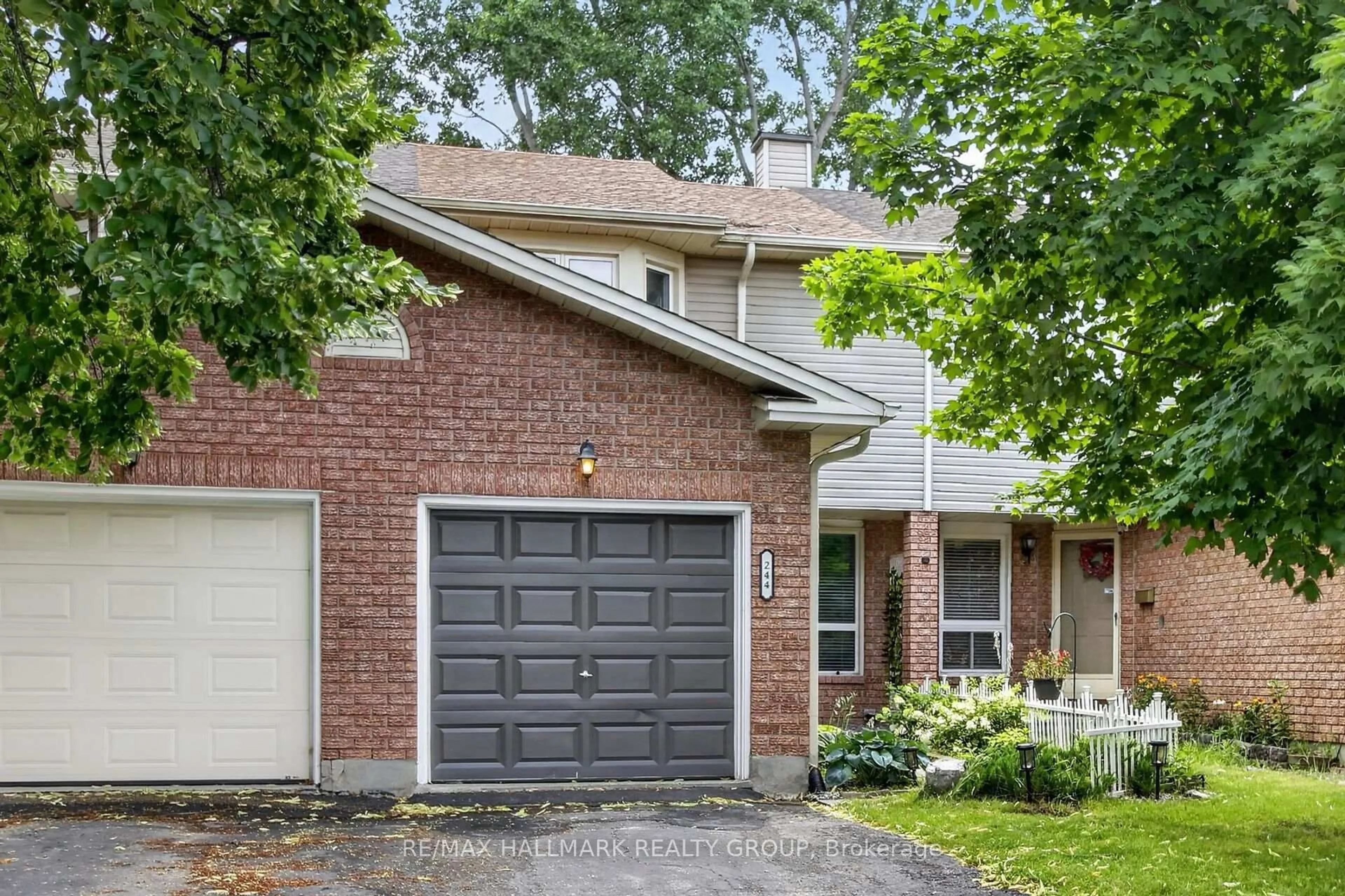 Home with brick exterior material, street for 244 Huntersfield Dr, Ottawa Ontario K1T 3M5