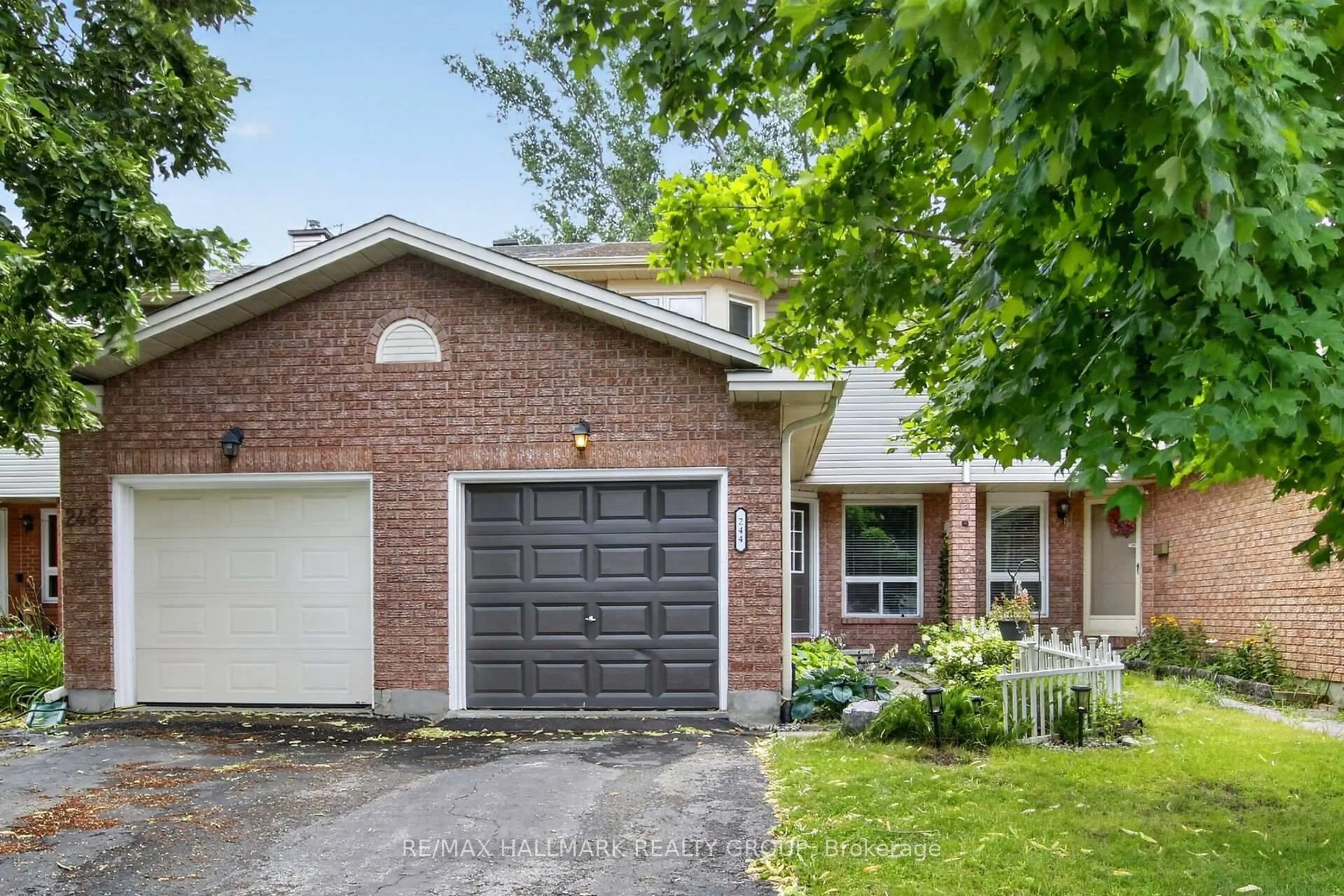 Home with brick exterior material, street for 244 Huntersfield Dr, Ottawa Ontario K1T 3M5