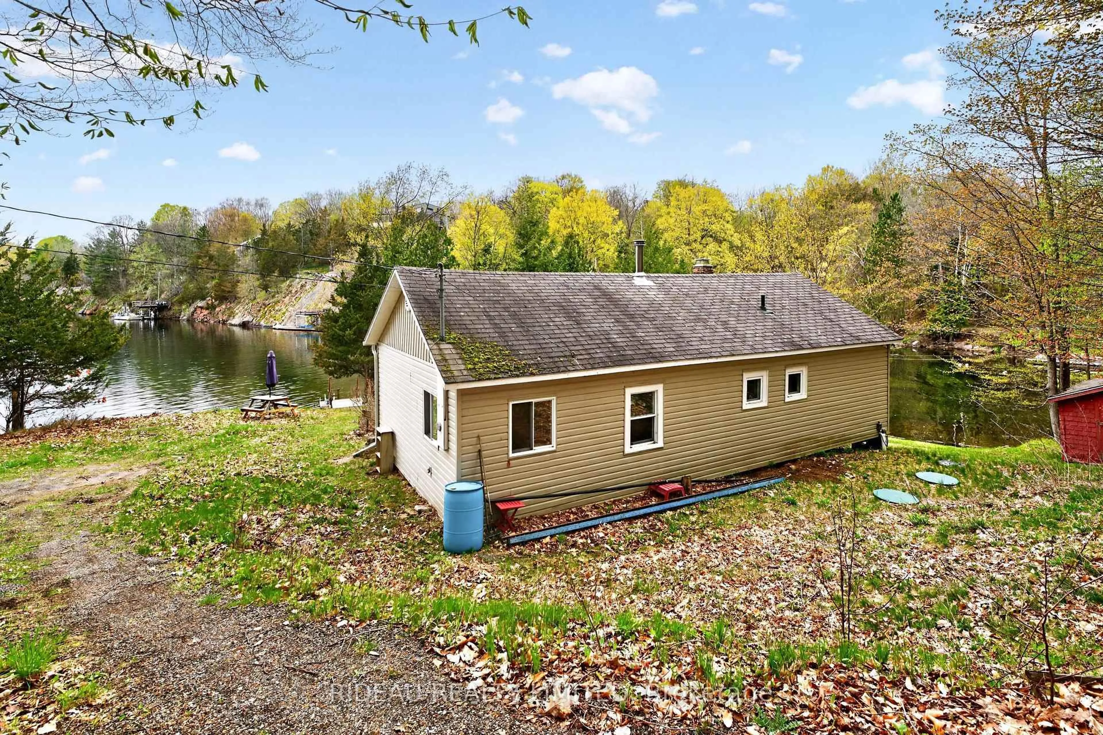 A pic from outside/outdoor area/front of a property/back of a property/a pic from drone, water/lake/river/ocean view for 9 Sparrow Lane, Rideau Lakes Ontario K0G 1V0