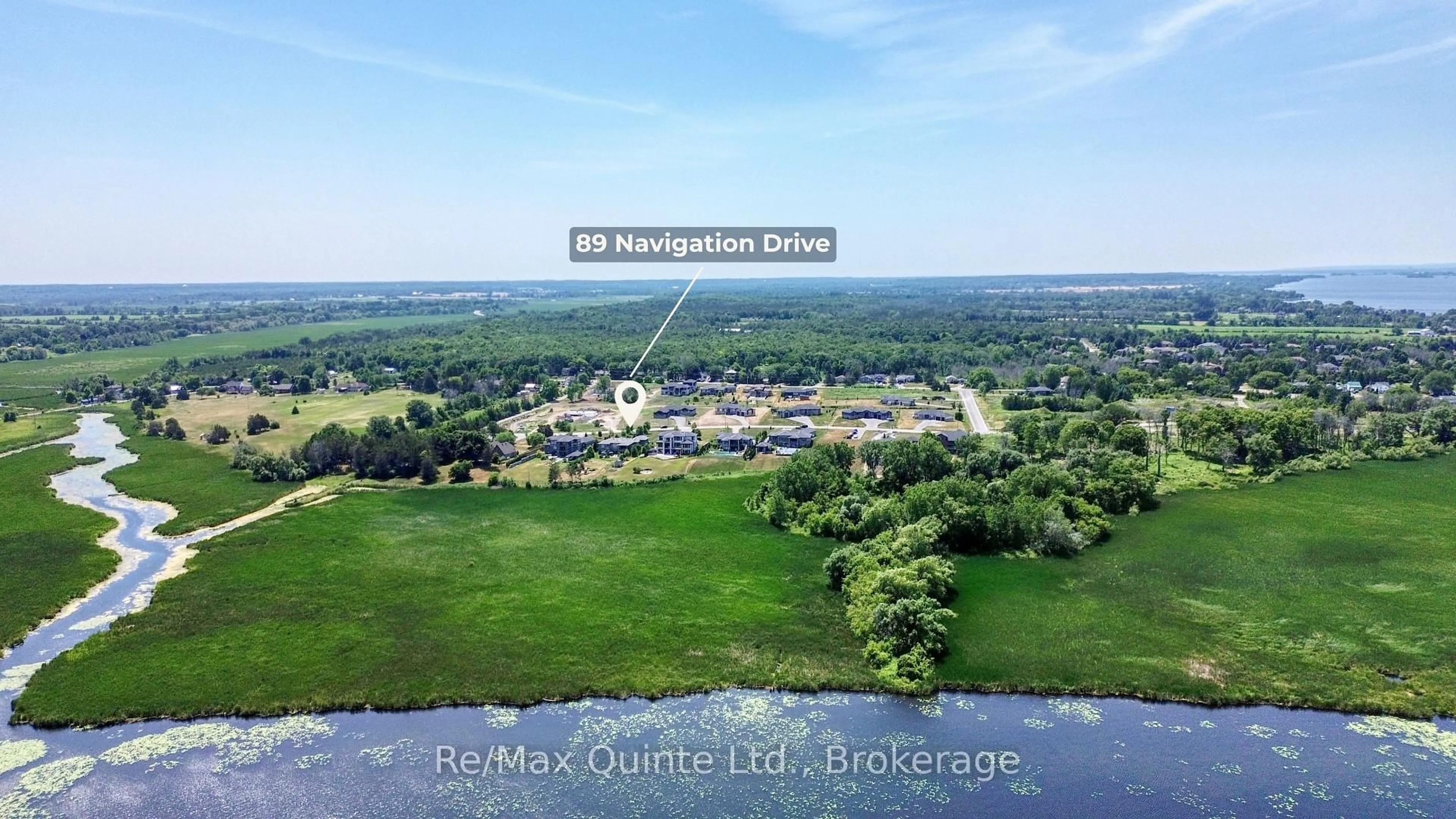 A pic from outside/outdoor area/front of a property/back of a property/a pic from drone, water/lake/river/ocean view for 89 Navigation Dr, Prince Edward County Ontario K8N 0G1
