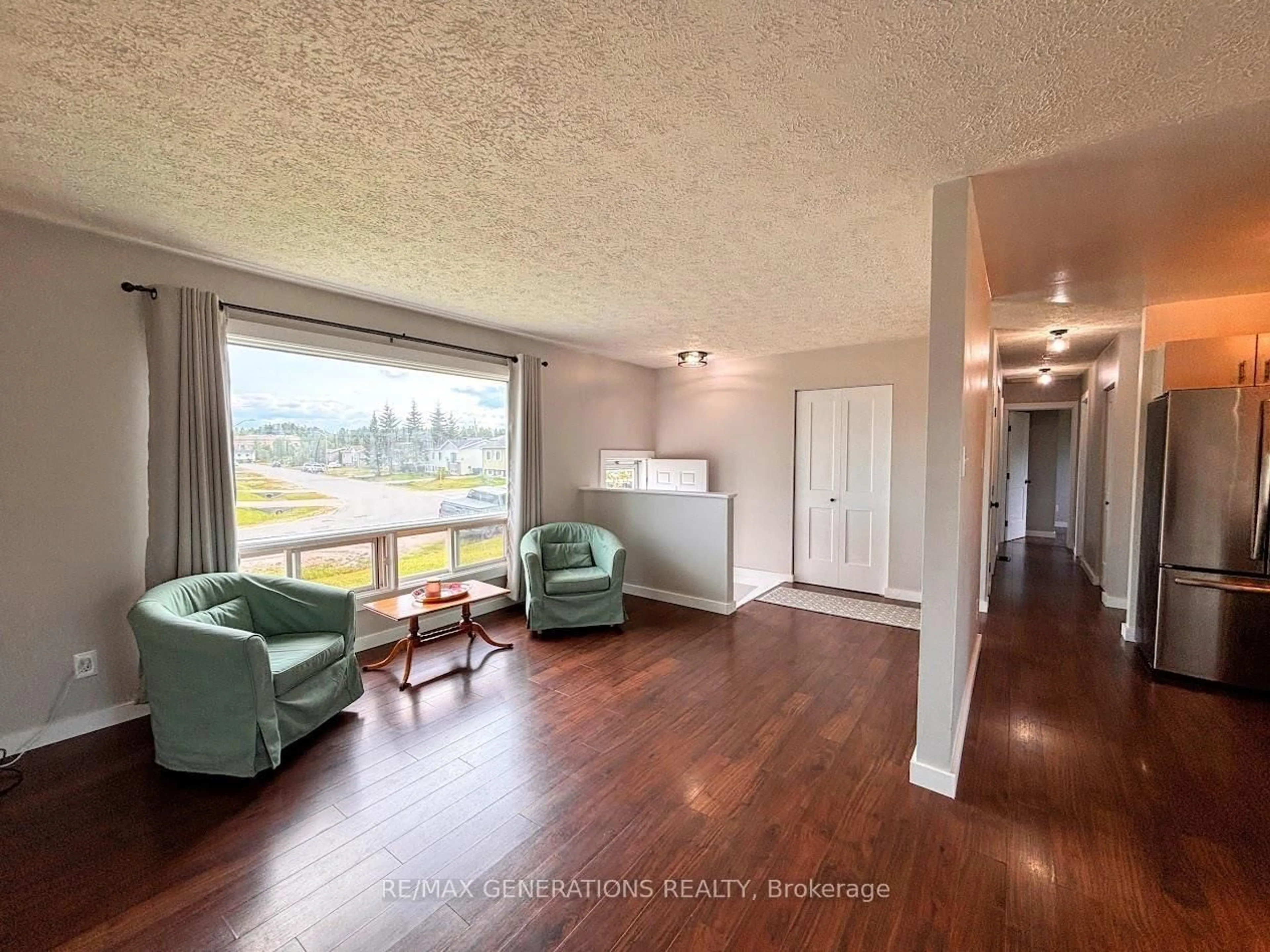 Living room with furniture, wood/laminate floor for 25 Brooks St, Manitouwadge Ontario P0T 2C0