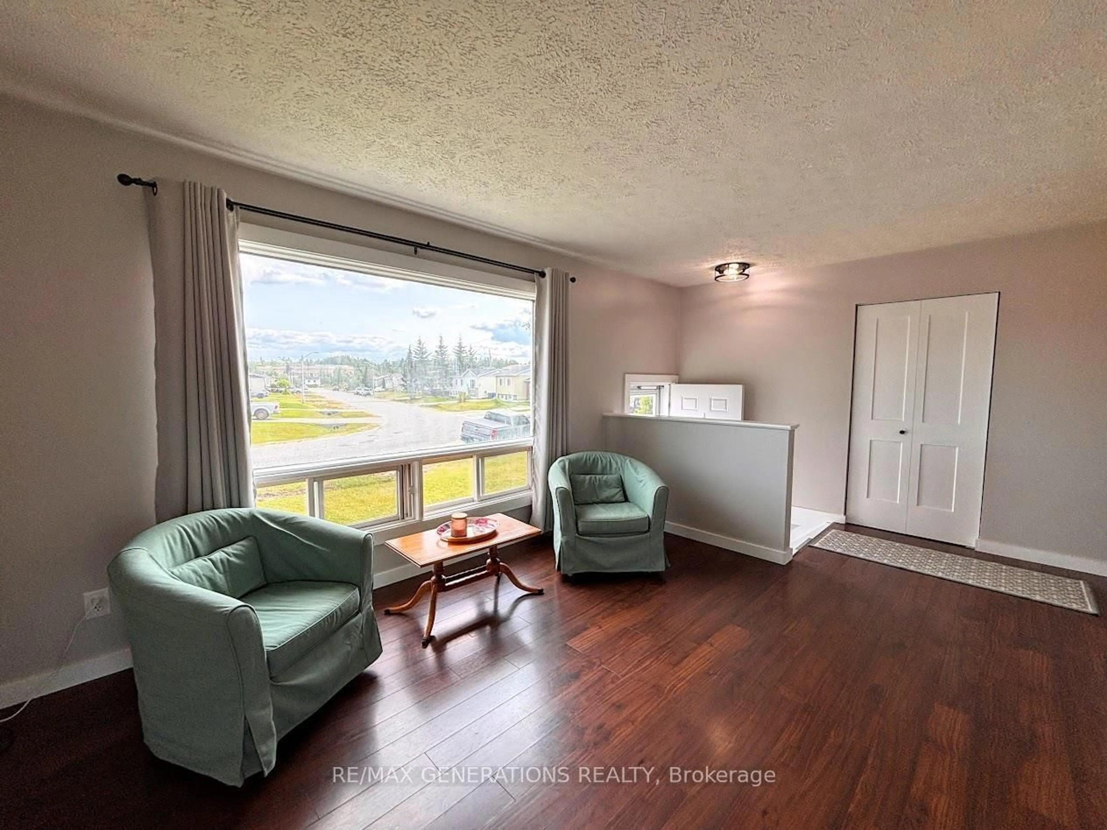 Living room with furniture, wood/laminate floor for 25 Brooks St, Manitouwadge Ontario P0T 2C0