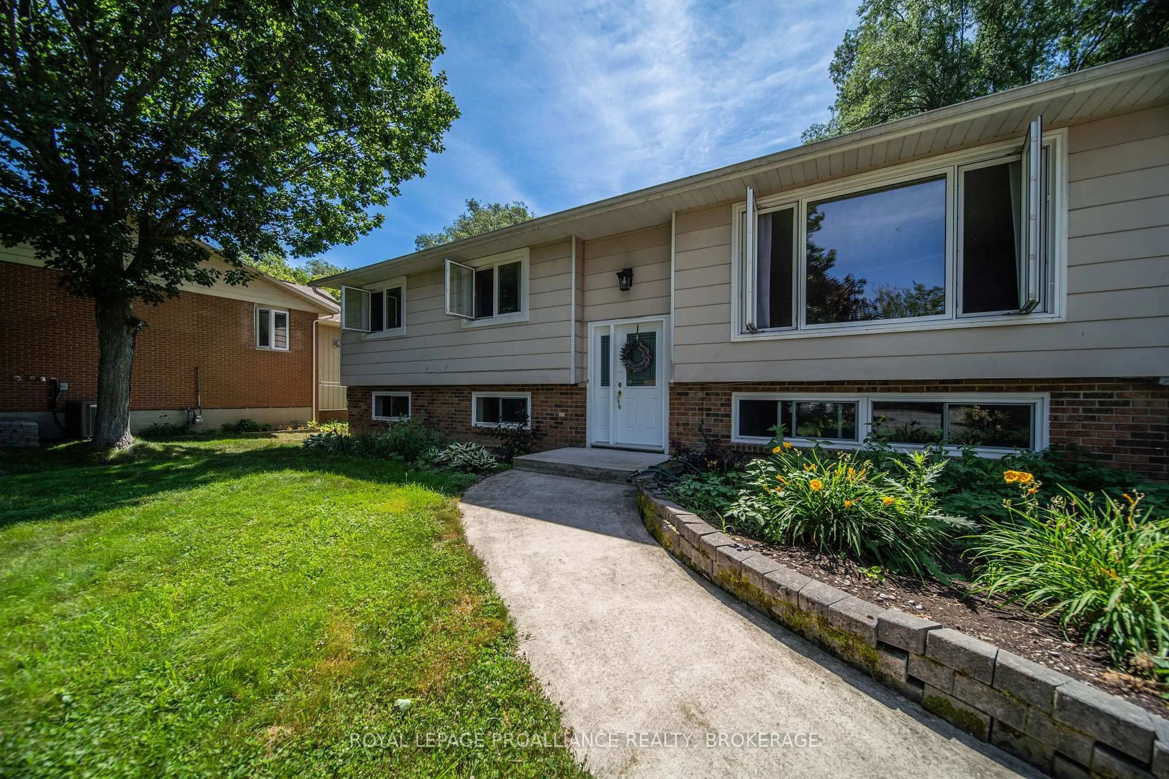 Home with vinyl exterior material, street for 94 Nicholson Point Rd, Bath Ontario K0H 1G0