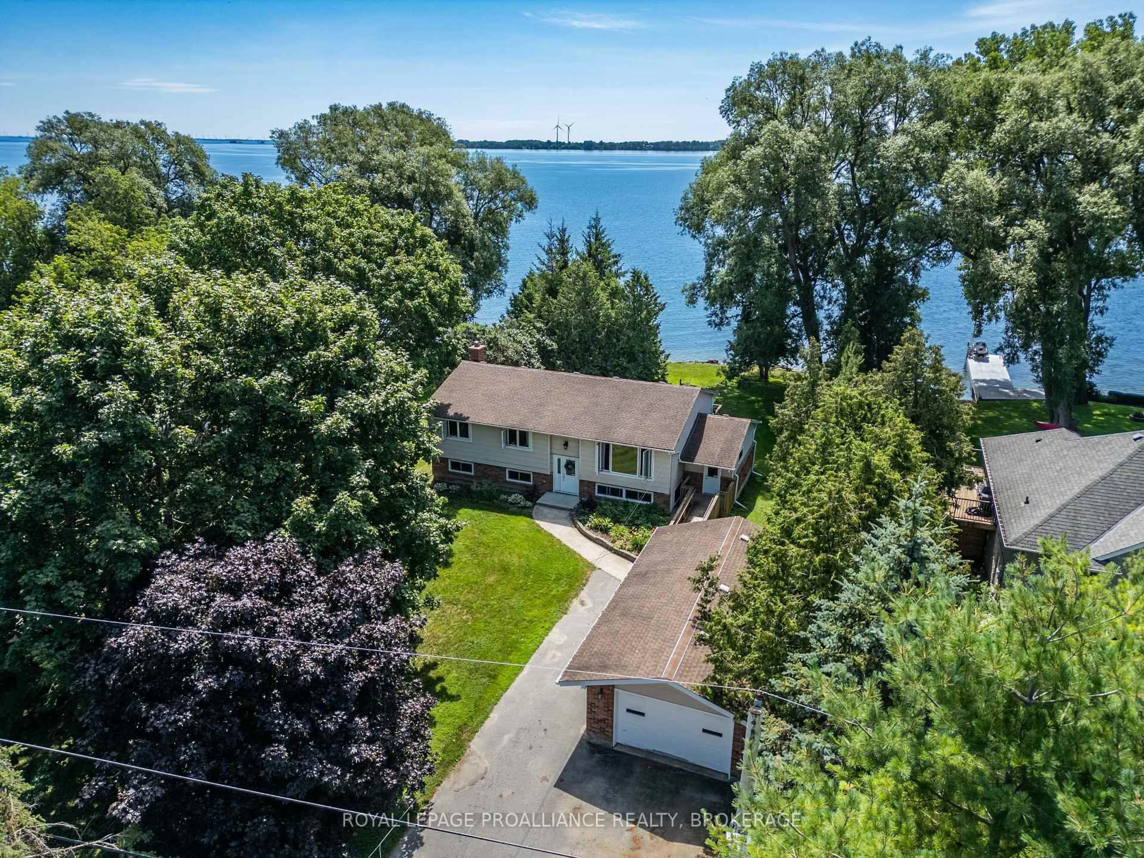 A pic from outside/outdoor area/front of a property/back of a property/a pic from drone, water/lake/river/ocean view for 94 Nicholson Point Rd, Bath Ontario K0H 1G0