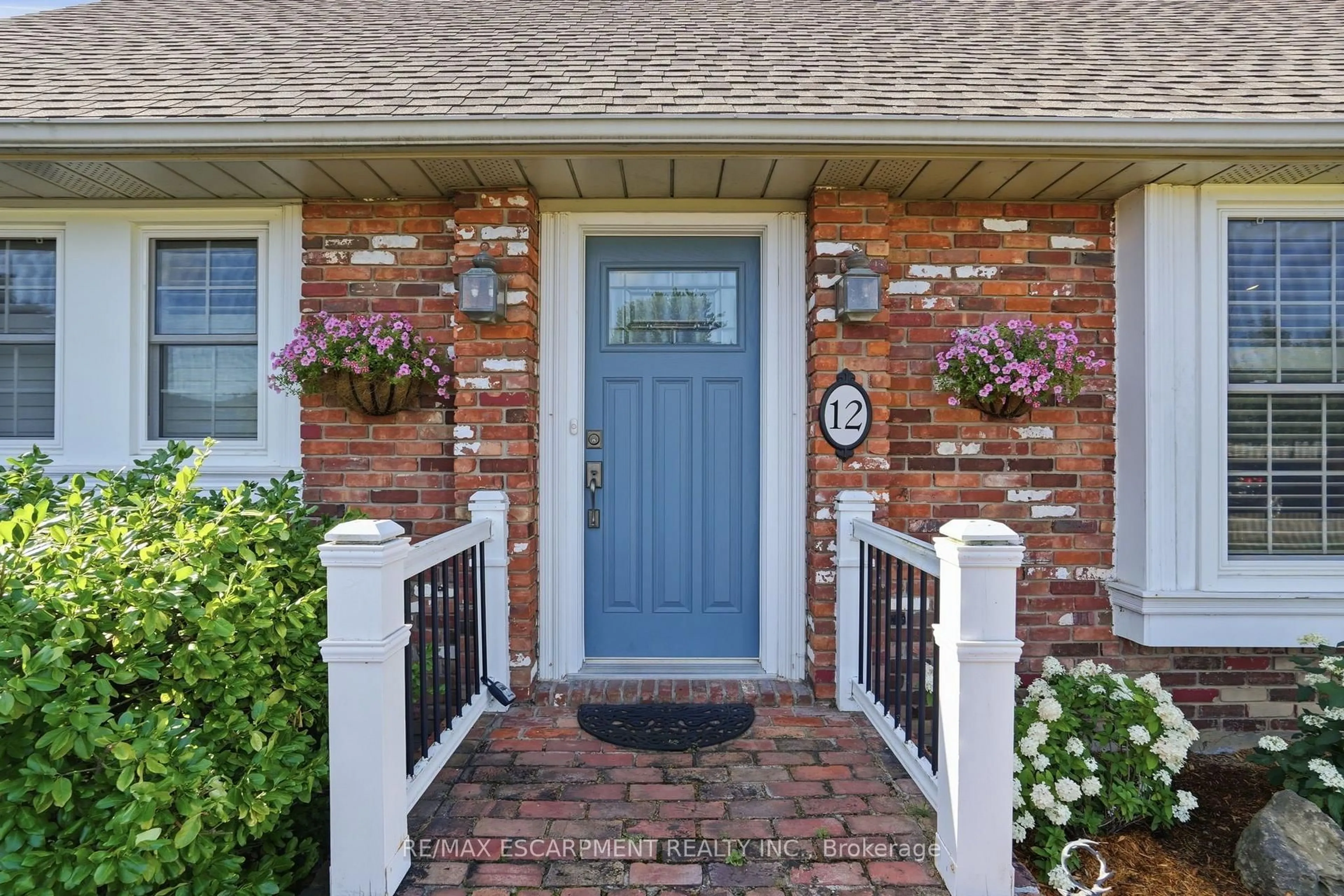 Home with brick exterior material, street for 12 Huntington Lane, St. Catharines Ontario L2S 3J5