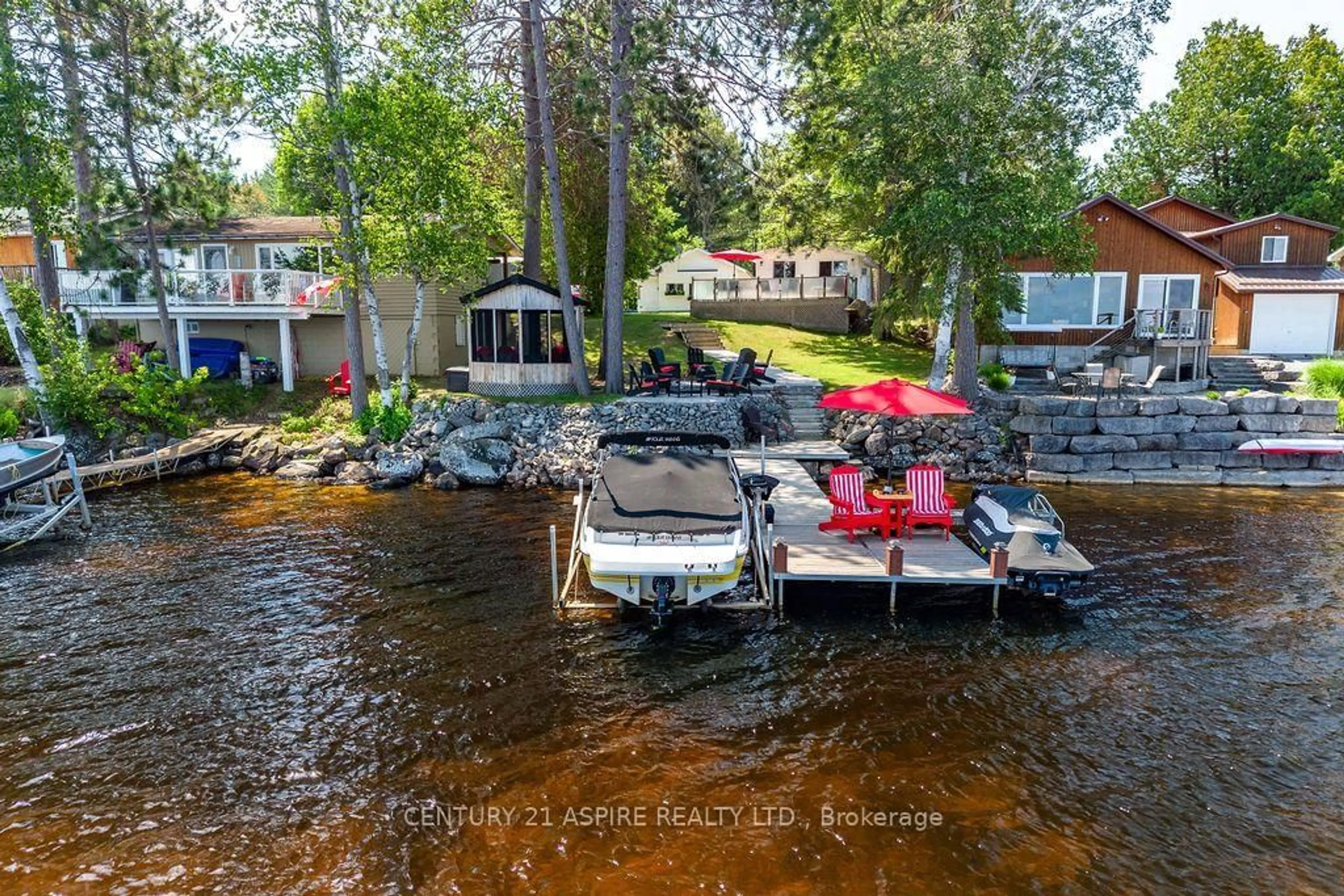 A pic from outside/outdoor area/front of a property/back of a property/a pic from drone, water/lake/river/ocean view for 747 Rock Point Lane, Round Lake Centre Ontario K0J 2J0