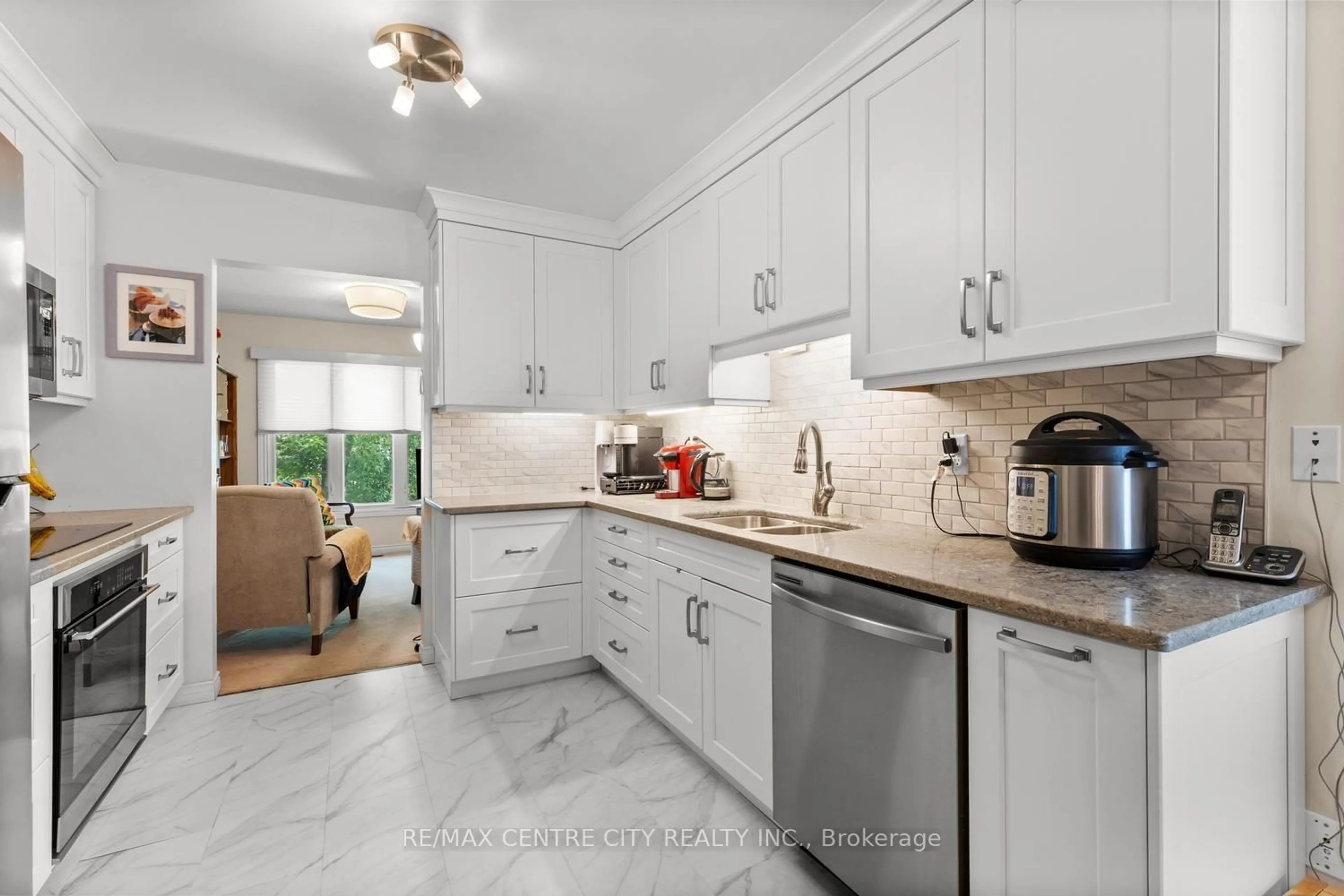 Open concept kitchen, ceramic/tile floor for 1500 Richmond St #104, London North Ontario N6G 4V1