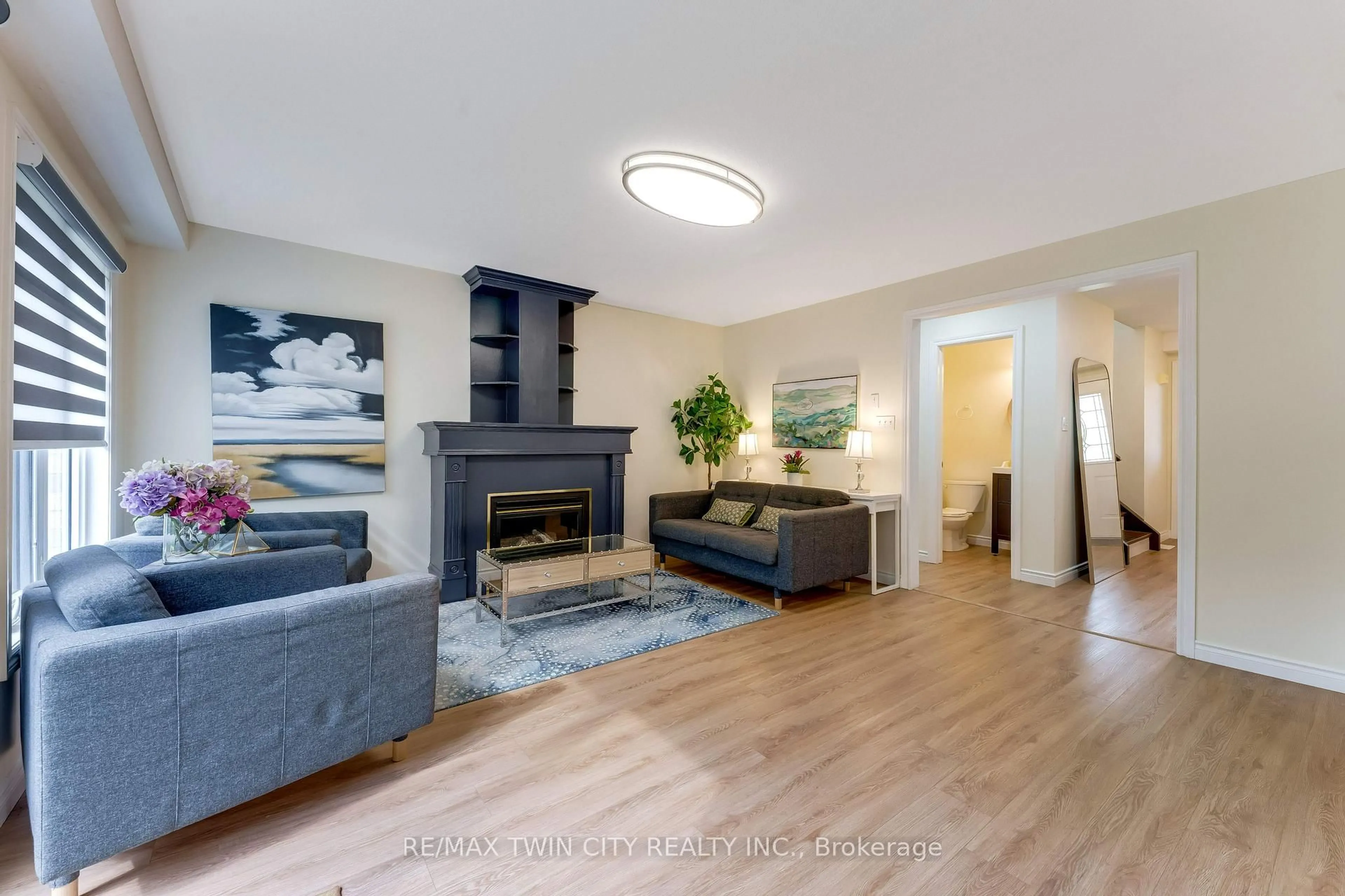 Living room with furniture, wood/laminate floor for 519 Yorkshire Dr, Waterloo Ontario N2T 2V1
