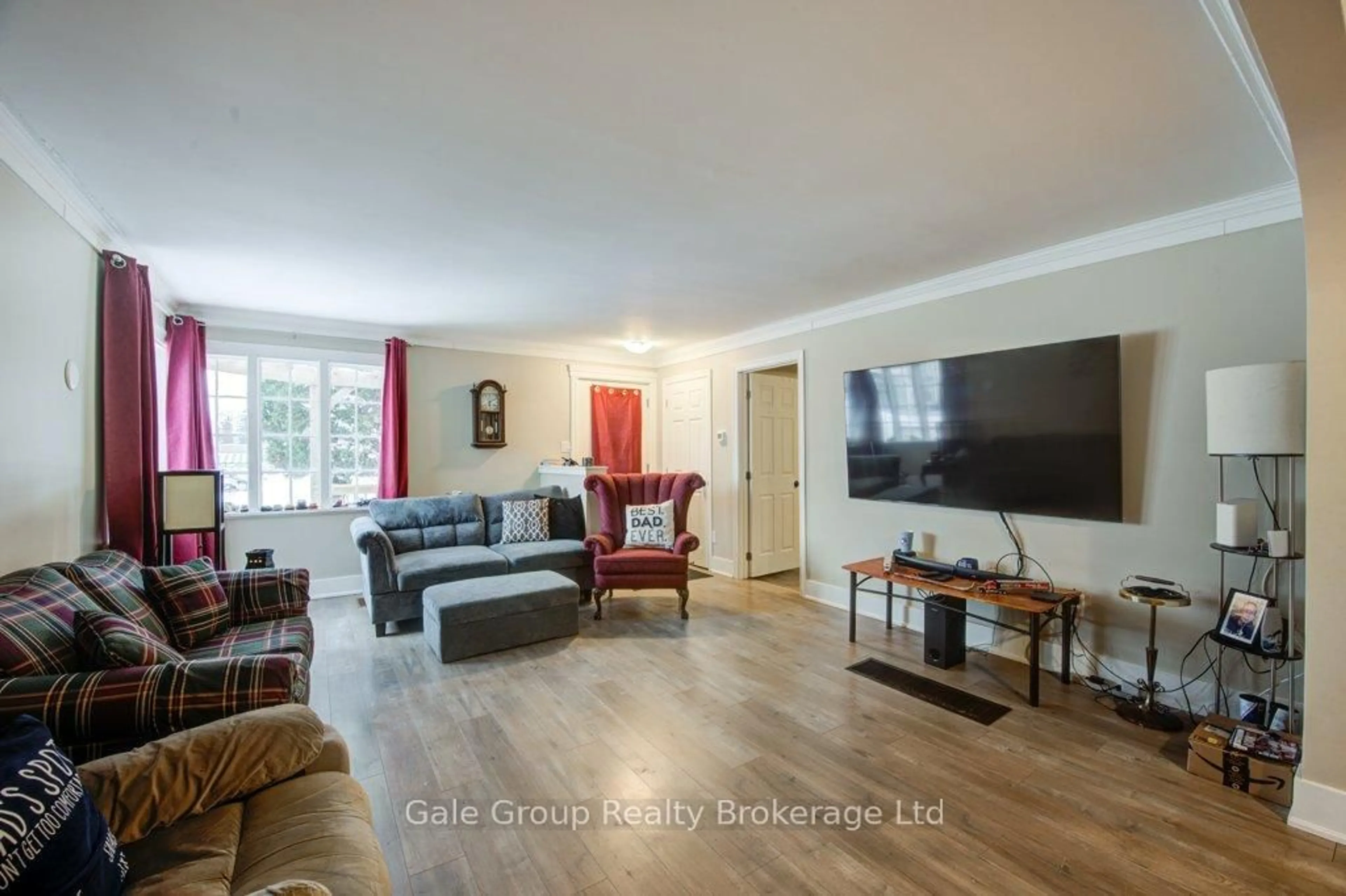 Living room with furniture, wood/laminate floor for 20 Teeple St, Woodstock Ontario N4S 3Y7