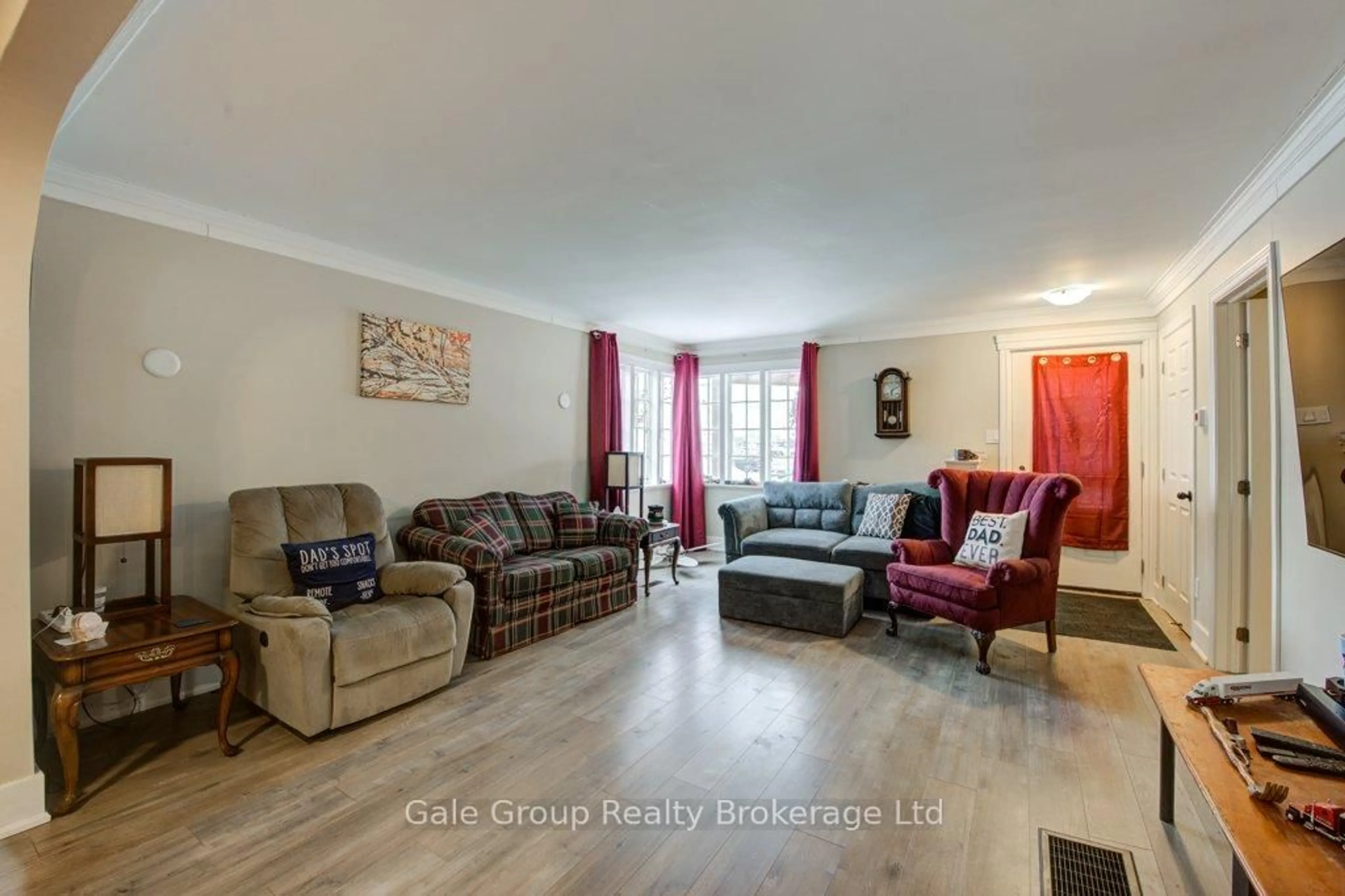 Living room with furniture, wood/laminate floor for 20 Teeple St, Woodstock Ontario N4S 3Y7