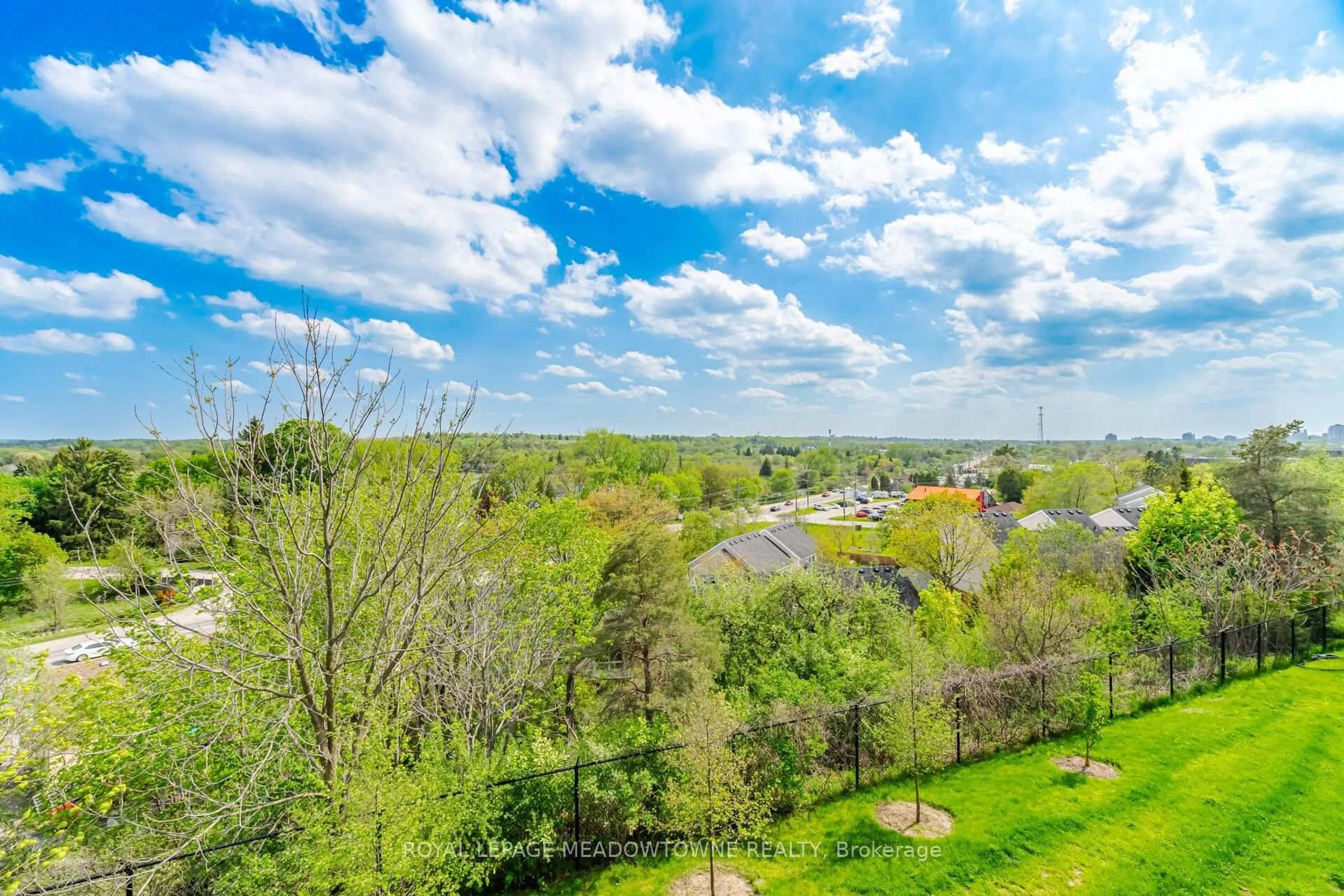 A pic from outside/outdoor area/front of a property/back of a property/a pic from drone, water/lake/river/ocean view for 7 Cityview Dr #207, Guelph Ontario N1E 0R1