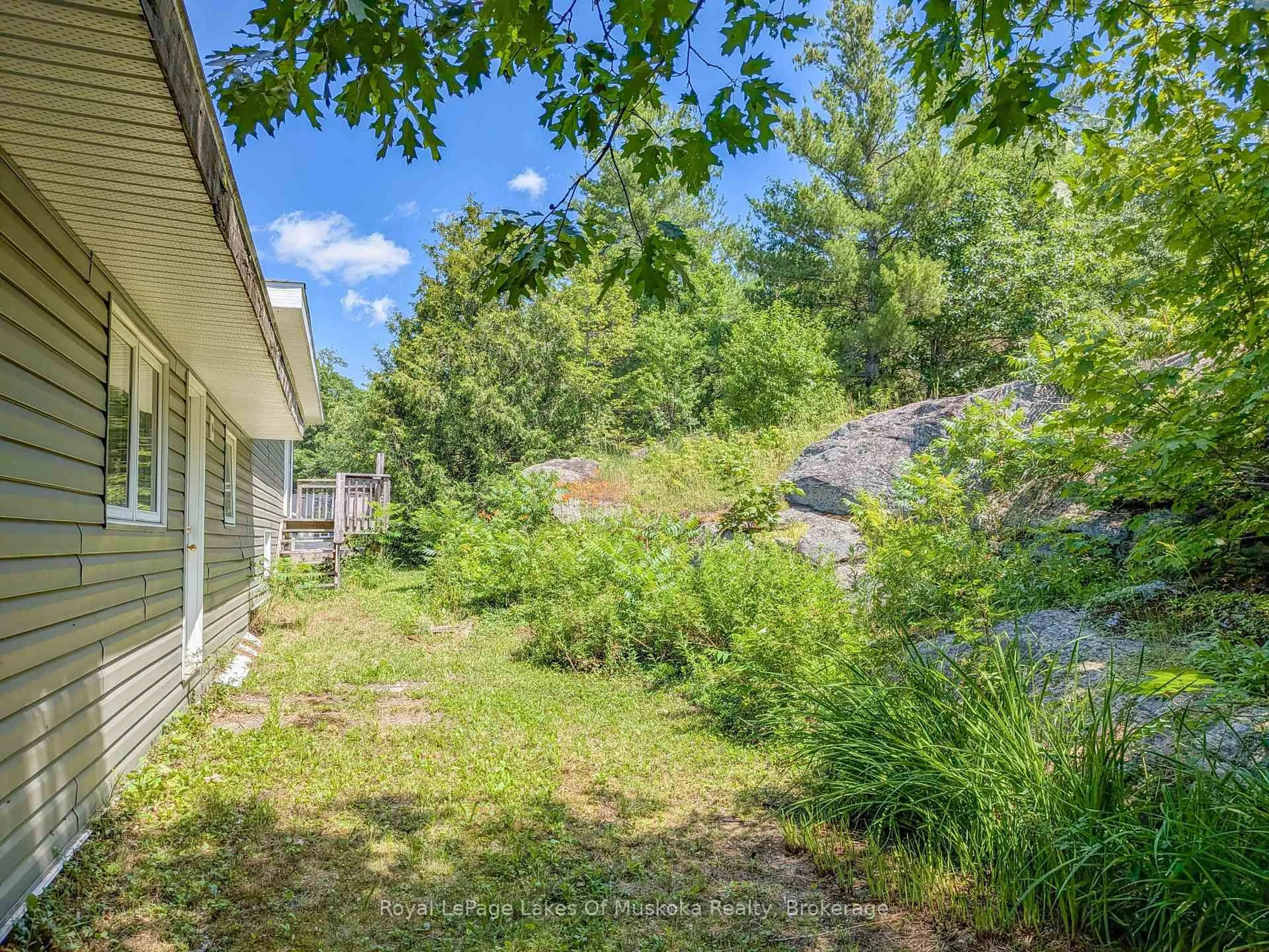 A pic from outside/outdoor area/front of a property/back of a property/a pic from drone, forest/trees view for 1314 Winhara Rd, Gravenhurst Ontario P1P 1R1