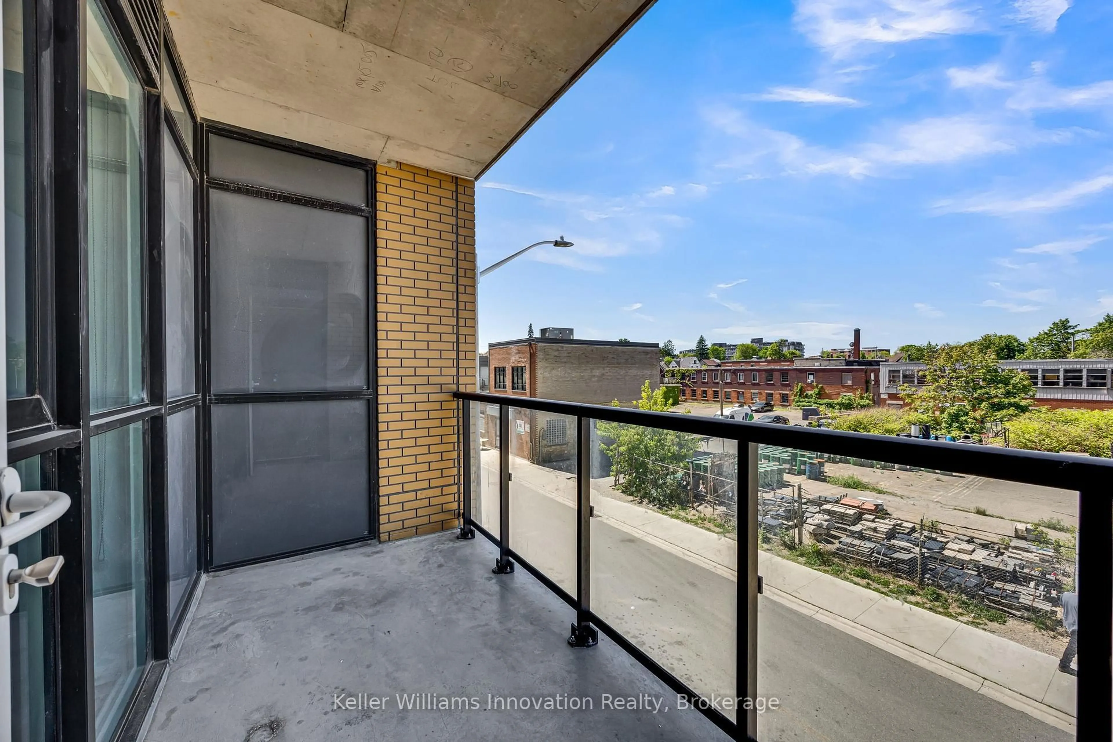 Balcony in the apartment, city buildings view from balcony for 108 Garment St #212, Kitchener Ontario N2G 0C3