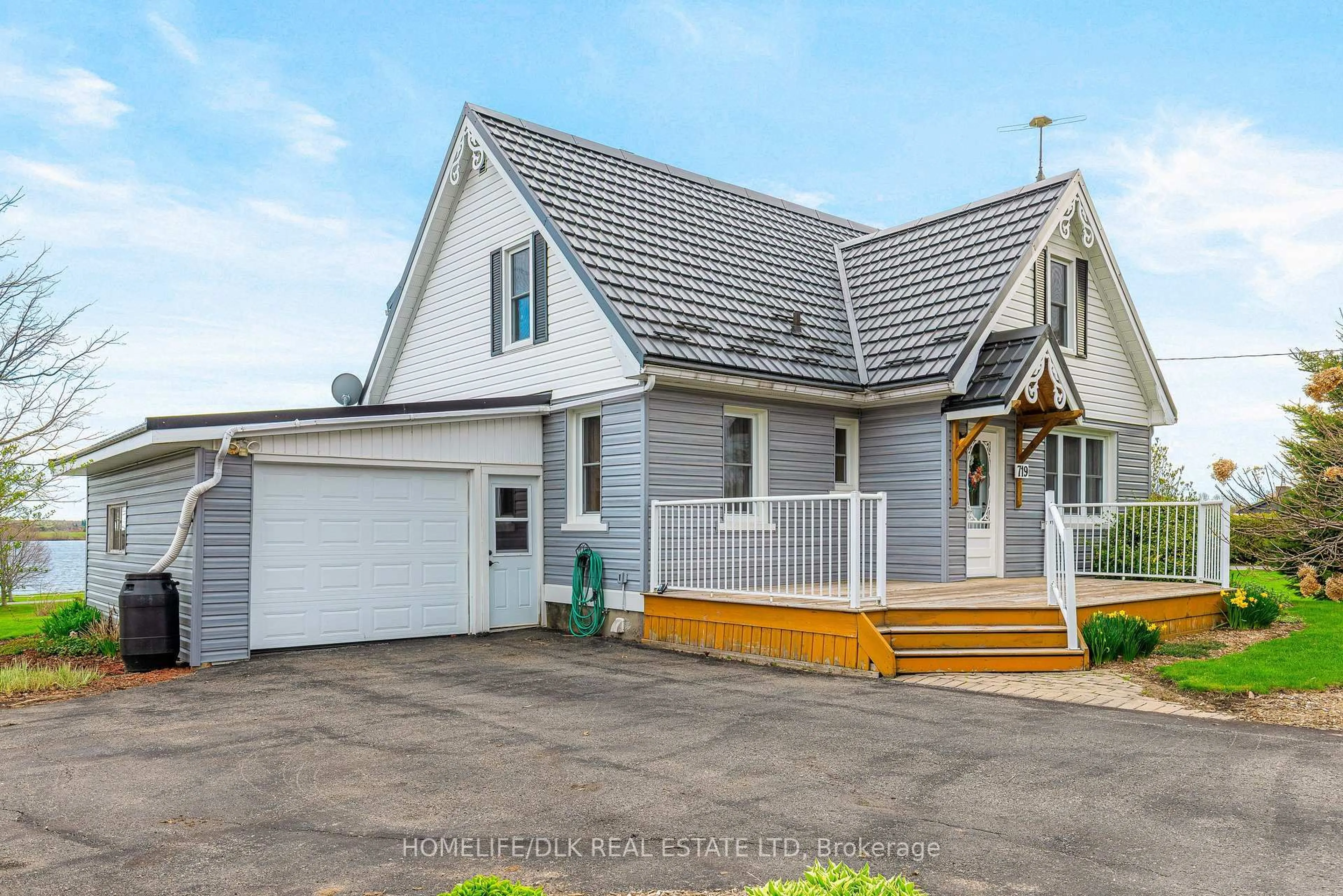 Home with vinyl exterior material, street for 719 County Road 2 Rd, Edwardsburgh/Cardinal Ontario K0E 1E0