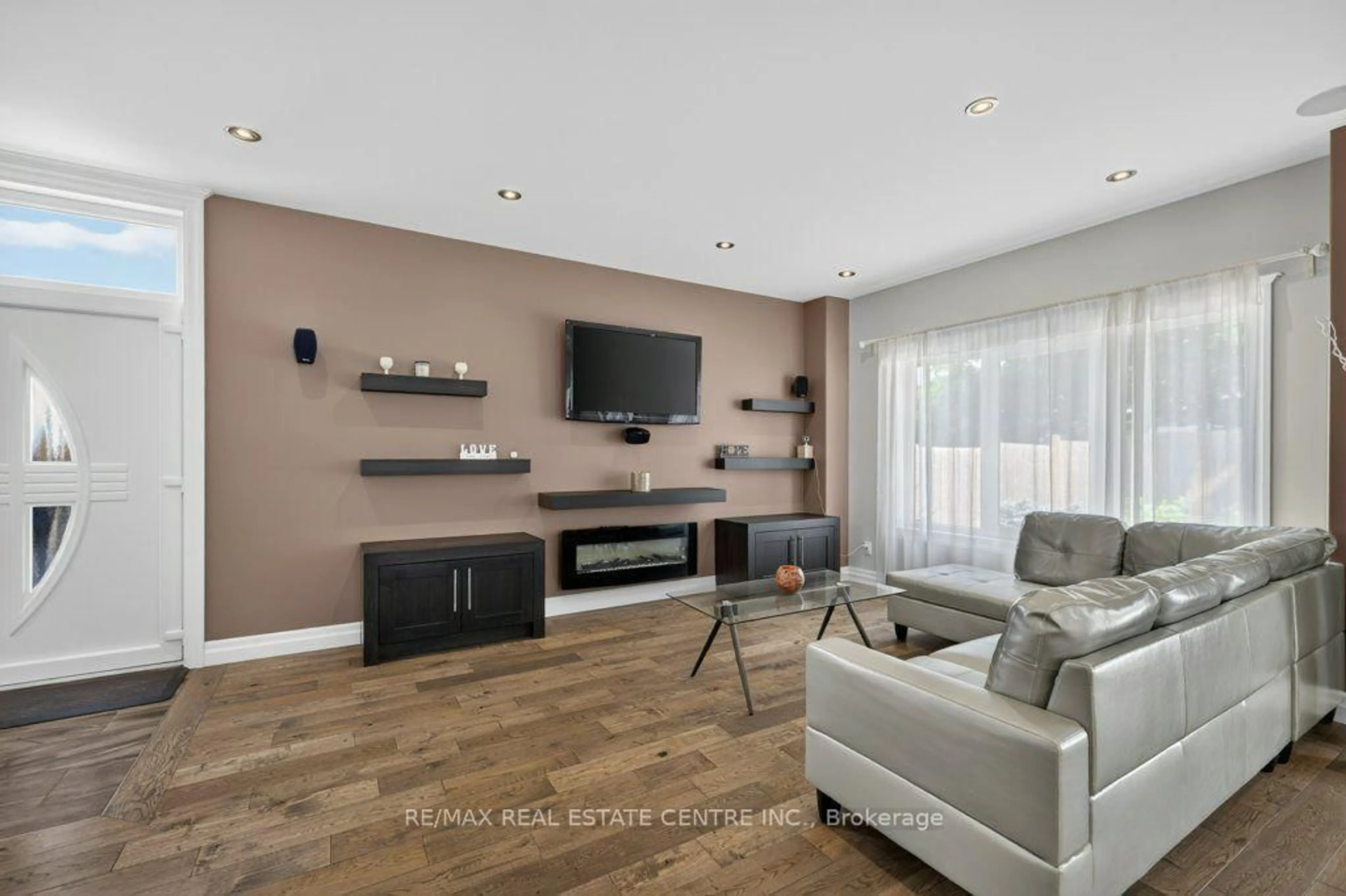 Living room with furniture, wood/laminate floor for 236 Neilson Ave, Waterloo Ontario N2J 2M3